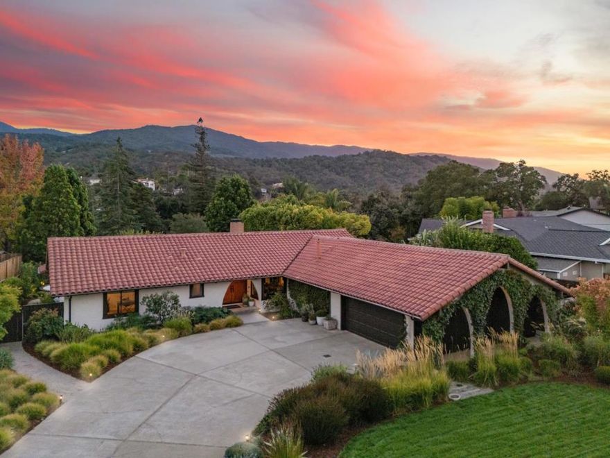 Almaden Country Club updated single-story! Mediterranean appeal w/ contemporary design- perfect balance betw timeless architecture & comfortable sophistication. Front porch entry opens to wall of windows showcasing beautiful hillside views! Handblown glass chandelier suspended by exposed beam vaulted ceiling, porcelain tile & hdwd floors thru-out! Great room anchored by dual-sided fireplace, wet bar w/ bev refrig & mirrored display wall w/ floating walnut shelving for elevated entertaining. Kitchen enjoys sleek walnut cabinetry, quartz counters, center island w/ walnut top & prof grade appliances. Serene primary suite has access to rear garden & lux bath enjoys dual vanity, spacious shower w/ pebble flooring, heated towel bar, walk-in closet w/ custom cabinetry. 3 guest bdrms w/ closet organizers share stylish hall bath. Bonus rm is great flexible space, once 3rd car garage expands homes versatility w/ bamboo flooring, heat/cooling. Outdoors unfolds into private oasis centered around inviting in-ground pool. Expansive covered patio w/ grilling station & lounge area for effortless entertaining & relaxing. Mature landscape ensures privacy w/o sacrificing views of surrounding hillside. Exquisite property inside & out plus top Almaden Schools, William, Bret Harte, Leland!