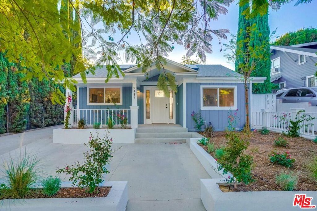 Offering classic curb appeal with its Craftsman-style exterior and inviting front porch, this beautifully remodeled bungalow is the epitome of modern elegance. Inside, the light-filled living area features vaulted ceilings and skylights, creating an airy, open feel. A cozy alcove off the living room makes the perfect home office or creative nook. The kitchen, meanwhile, comes fully equipped with stainless steel appliances, including a gas range, dishwasher, microwave, and counter-depth fridge. Bedrooms on either side of the home open to a private, fully fenced 650 SF patio and garden. Additional highlights include ample closet space, an in-unit LG washer/dryer, central heat/AC via a Nest thermostat, and stylish finishes. Situated at the front of a peaceful three-home compound just north of Colorado Blvd, this home offers easy access to all of Eagle Rock's hotspots, including Vidiots, Walt's, and Capri Club and is less than five minutes from Occidental College and the 2 and 134 freeways. Includes 1 parking space at the front of the house. Pets Ok! Owner pays Water & Sewer.