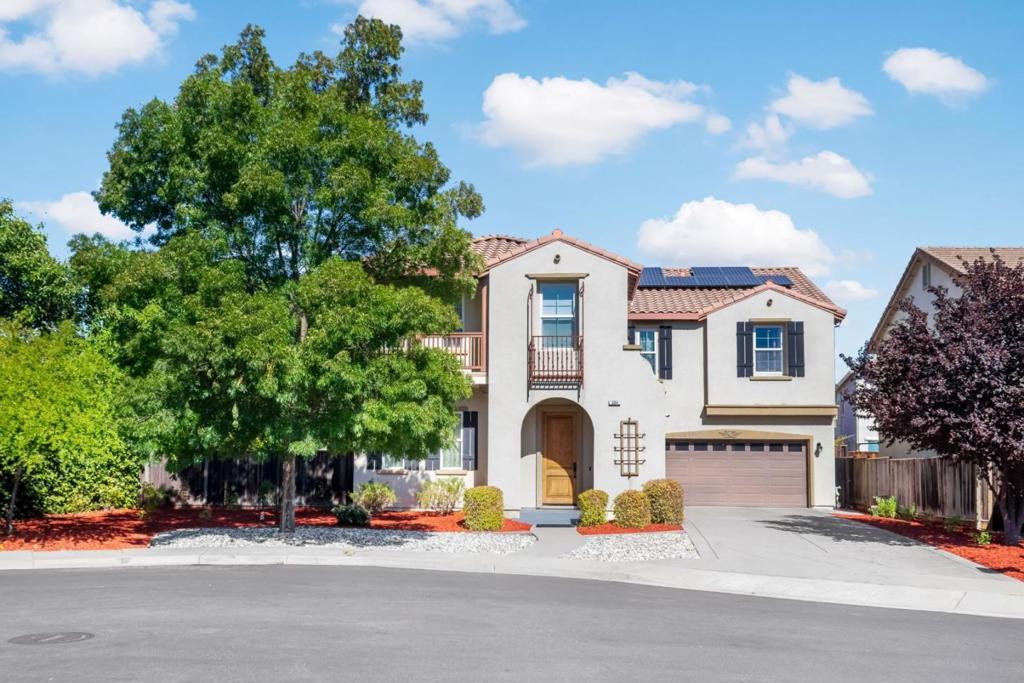 Discover luxury and comfort in this Windemere gem, San Ramon's most sought-after neighborhood. Built in 2003, this grand home is 4-bedrooms, 4-baths, blends thoughtful design with extensive and premium upgrades for an elevated lifestyle. Enjoy newer flooring and paint, soaring ceilings, and two fireplaces. A main-level bedroom and full bathroom adds guest convenience, while the fully remodeled chefs kitchen showcasing top-line finishes, premium counters, large center island, gas range, and built-in desk flows seamlessly into the family room, perfect for gatherings. The expansive primary suite offers a jetted tub, spacious shower, dual vanities, and walk-in closet. Upstairs, a loft, bonus room, and tech center with built-ins provide flexible living, complemented by upstairs laundry and hallway bookshelves. Hi-tech lighting, stylish bathrooms and custom window treatments pair with owned solar panels and a Tesla charger to deliver modern comfort and efficiency. Outside, a low-maintenance yard, peaceful cul-de-sac setting, and 3-car tandem garage add convenience and appeal. Located within a top-rated school district and walking distance to Hidden Hills Elementary, Windemere Ranch Middle and Dougherty Valley High, this home offers exceptional lifestyle and strong investment value.
