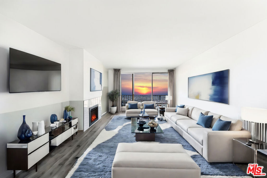 Stunningly remodeled penthouse with abundant natural light and peek-a-boo ocean vistas, nestled in the vibrant heart of Santa Monica just moments from the chic boutiques of Montana Avenue. This rare corner unit boasts 2 bedrooms and 2 bathrooms, each offering expansive views of both the coastline and mountains. The modern gourmet kitchen is a chef's dream, featuring quartz countertops, stainless steel appliances, bespoke shaker cabinetry, and a convenient breakfast bar that seamlessly connects to the dining area. Throughout the condo, you'll find elegant light gray flooring complemented by a pristine white tiled fireplace. Indulge in luxury within the master bathroom, which showcases custom vanities, a sumptuous bathtub, and a separate glass door shower. With only a block separating you from the bustling shops and dining options of Montana Avenue, and mere minutes from Palisades Park, Third Street Promenade, and the beach, convenience and leisure are at your fingertips. Additional amenities include two side-by-side parking spaces, a recreational room, hot tub, and sauna, ensuring a lifestyle of both comfort and indulgence.