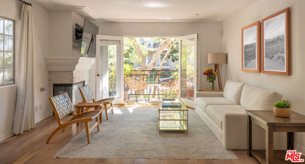 This beautifully maintained 2 bedroom, 2 bathroom condo offers 1,472 square feet of comfortable, private living in a boutique 8 unit building. With no shared walls and a second floor location in an elevator served structure, the unit lives more like a standalone home. Each bedroom is well sized with generous storage space. Primary bathroom features dual sinks, bath tub spa, and freestanding shower. Both bathrooms have white carrara marble countertops, floors, and showers. Features include a private front patio, a dedicated doggy patio with BBQ area, and in unit laundry with full size washer and dryer. A bonus nook is perfect for a home office or Peloton setup. The spacious kitchen offers stainless steel appliances and generous cabinet space. New dishwasher, range, and HVAC system were all installed in 2024. Gas meters replaced in 2023. The HOA covers building, water and sewer, common gas and electricity, trash, landscaping, elevator maintenance, and more - making ownership simple and low maintenance ownership. Ideally located between Beverly Hills and West Hollywood, in one of LA's most desirable and walkable neighborhoods. This home is move in ready and available furnished.