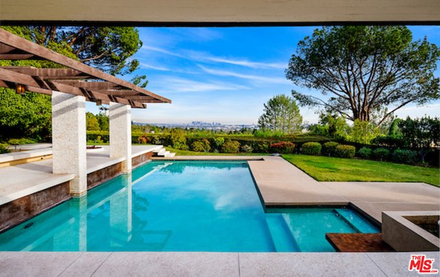 The last great view estate in Beverly Hills! Available for the first time in over fifty years, "North Alpine Estate" is one of Hal Levitt's greatest architectural accomplishments. The 5,614 square footage house sits on the greatest flat 24,468 square foot view promontory. Enter into a large motor court, and walk through the front doors and be faced with immediate stunning city light views of Downtown Los Angeles and Beverly Hills. With a combination of 20 foot and 14 foot ceilings, this is mid-century architecture at its finest.