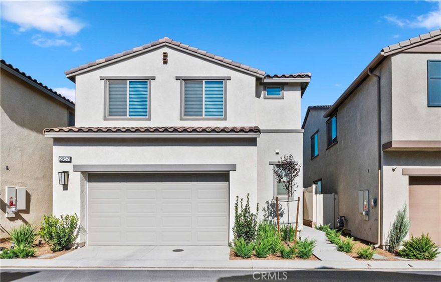 Shows like a Model Home and thoughtfully upgraded throughout, it’s a must-see. Inside, you’ll find a kitchen where creativity and connection come to life. Designed for the chef at heart and for the host who loves to gather family and friends, every detail invites warmth and togetherness. From the spacious countertops perfect for holiday baking to the open layout that keeps everyone part of the conversation, this is where memories are made. Whether you’re serving up your signature dish or sharing laughter over morning coffee, this kitchen is the heart of the home. The main living area features luxurious vinyl plank flooring and a newly built fireplace. Upstairs, in addition to the three bedrooms, the loft offers the perfect retreat with plenty of room to relax and unwind.

The beautifully landscaped backyard is designed for entertaining. It's ideal for gatherings, barbecues, or simply enjoying the outdoors. Plus, with no neighbors behind, you’ll enjoy added privacy and peaceful views. All of this is located in a thriving community with a low HOA, where residents enjoy a resort-style clubhouse and top-tier amenities that truly elevate your lifestyle. Don’t miss your chance to be among the first to tour this beautiful home.