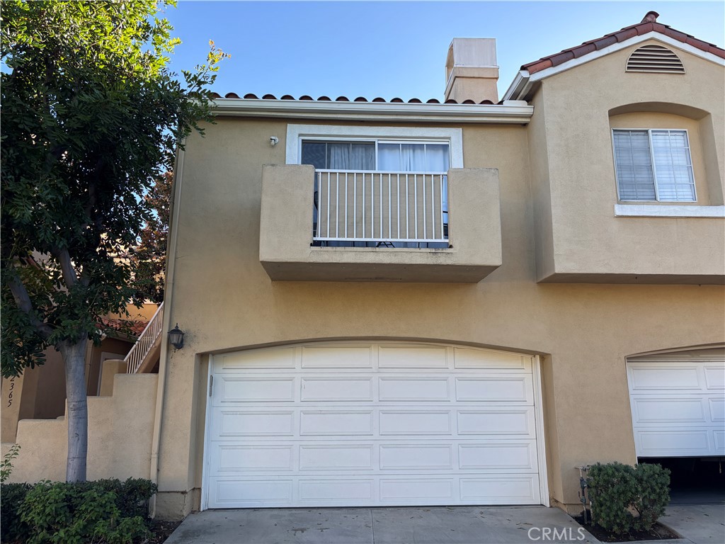 Spacious 2 Bedroom, 2.5 Bathroom townhome in the gated community of Estancia in Tustin Ranch. The living room features a fireplace and direct access to a private patio, creating a comfortable space for relaxing or entertaining. Upstairs, there are two bedrooms, each with its own private bathroom. The primary bedroom includes dual sinks and a closet. The second bedroom also has its own bathroom. Other highlights include a downstairs powder room, an indoor laundry area with washer and dryer, central air conditioning, and a two-car attached garage. The Estancia community provides a pool, spa, and well-maintained common areas. Conveniently located near Heritage Park, shopping, dining, and major freeways, this home combines both comfort and convenience in the heart of Tustin Ranch.