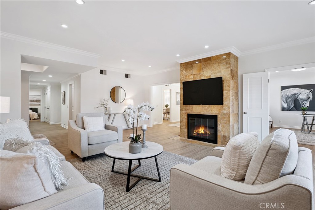 Welcome to your dream home, an expansive 2,203 sq. ft. single-story condo in a boutique 12-unit complex. This rare find combines space, style, and convenience. One of the largest condos on the market in Encino, this three-bedroom residence feels like a luxurious single-family home. From the moment you enter the updated lobby with secured entry, you’ll appreciate the privacy and exclusivity of this community. Inside the unit, brand-new flooring flows seamlessly through the sunlit living spaces, complemented by fresh paint and stylish new lighting. The elegant living room centers around a charming fireplace, creating a warm gathering spot. Plantation shutters and large windows flood every corner with brightness. The gourmet kitchen features stainless steel appliances—gas cooktop, double wall oven, new microwave, dishwasher, and refrigerator—alongside a cozy breakfast nook. The primary suite boasts a bonus space ideal for an exercise bike, reading nook, or additional walk-in closet. Two additional bedrooms - one could easily be used as a light-filled home office- share a granite countered bath. An updated powder room, in-unit washer/dryer hookup and great storage make this home complete. Step outside to your own large private terrace, where you can enjoy morning coffee or evening cocktails. Secure tandem parking for two cars is in the gated garage. Low HOA dues include earthquake insurance, a sparkling community pool, spa, and a BBQ area. Conveniently close to Encino Commons, Trader Joe’s, restaurants, with easy access to the 101 Fwy, this home offers the perfect balance of city access and serene living.