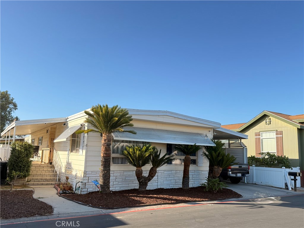 Welcome to 2300 Lewist St Spc 92, Anaheim, CA 92802 – a spacious and stylish 3-bedroom, 2-bathroom double wide mobile home nestled in a desirable all-ages community. This thoughtfully updated home offers comfort, style, and convenience all in one package. Step inside to discover luxury plank wood-style flooring throughout, adding warmth and elegance to every room. The open-concept kitchen features gorgeous quartz countertops, perfect for cooking and entertaining. Stay comfortable year-round with central AC. The primary bedroom is generously sized, with a large en suite bathroom that includes a dual vanity—perfect for added convenience and storage. Two additional bedrooms provide plenty of space for family, guests, or a home office. Also included is the water softener and storage. Community amenities are truly resort-style, featuring a swimming pool, jacuzzi, indoor gym, sport court, and a huge clubhouse—ideal for gatherings and activities. Don’t miss this opportunity to live in a vibrant, amenity-rich neighborhood in the heart of Anaheim!
