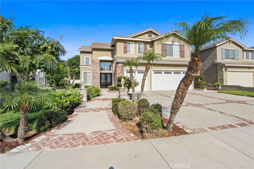 Hello and welcome to 3364 Centurion Place! From the moment you arrive, you will absolutely love the beautifully landscaped front yard and the stunning curb appeal. This gorgeous two-story home features high ceilings, a bright and open floor plan with 4 bedrooms and 3 bathrooms, a library downstairs which can easily be converted into a 5th bedroom, an indoor laundry room with built-in sink and cabinets, an open floor living and dining room, and a spacious family room open to the remodeled modern kitchen, which offers a granite countertop island, walk-in pantry, stainless steel appliances, self-closing cabinet doors, and stone flooring throughout.
As you walk up the beautiful hardwood floor staircase, you will be greeted by a huge master suite with high-beamed ceilings, a large master en-suite bath, and dual large closets, one of which is a walk-in closet with plenty of shelving. Also upstairs are 3 additional bedrooms and a media room with a beautiful media unit. Hardwood flooring is also throughout the second floor. You will love the numerous windows throughout that allow beautiful lighting to come through.
The spacious backyard is fully enclosed for ultimate privacy and has a large patio cover with inset lighting, perfect for your summer entertainment and special family gatherings. Schools, shopping, and restaurants are nearby, and the Ontario Airport is just minutes away. This coveted neighborhood awaits you. You will be proud to call this "home" and will enjoy it for years to come. Don't wait this home will not last!