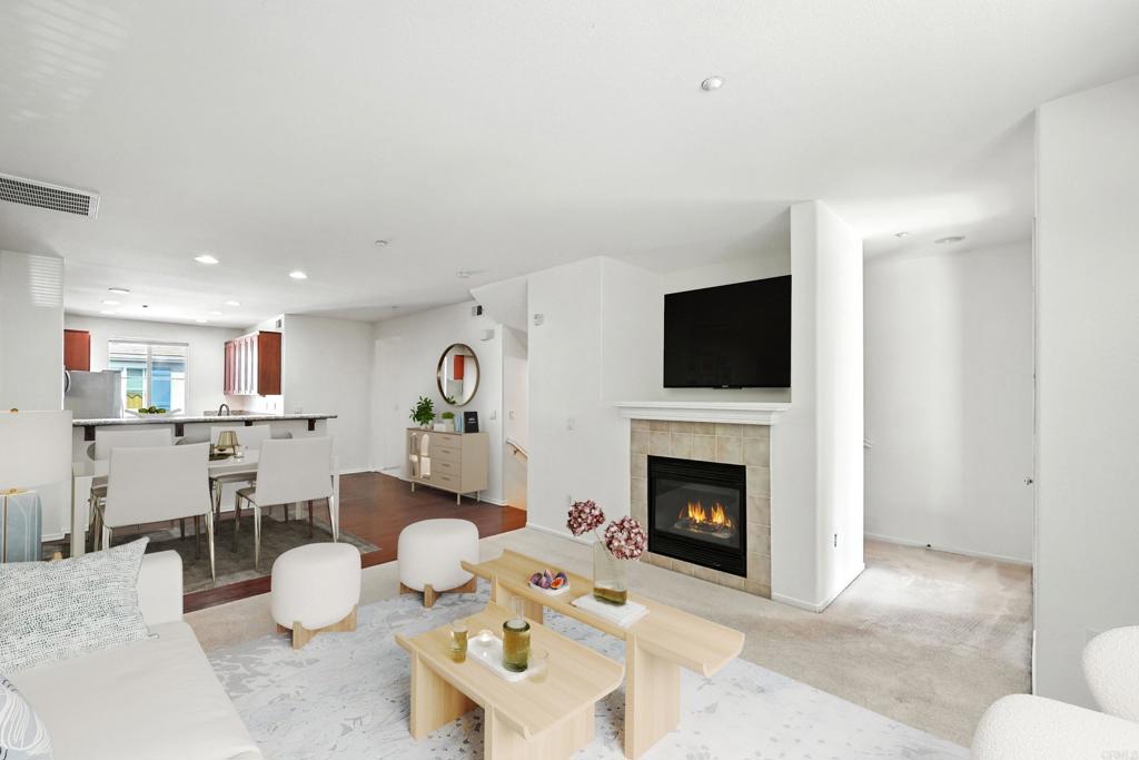 Coveted four bedroom townhome in Otay Ranch with a rare layout that offers bedrooms on every level, each having their own dedicated full bath. The main living space boasts an open floorplan featuring a kitchen with granite countertops and breakfast bar overlooking the dining area and living room with fireplace & outdoor balcony. A spacious primary bedroom includes a walk-in closet with custom built-ins and ensuite bath with dual vanity and soaking tub. This home’s unique layout provides an attached 2-car garage, dedicated laundry room, and flexible spaces to meet any need, including guest room, office, gym, or playroom. Amenities include two community centers with pools & spas, children’s pool, BBQ, gym, playgrounds, and even a stocked catch-and-release fishing pond. Located across from the Chula Vista Olympic Training Center with shopping, dining, golf, and hiking trails nearby.