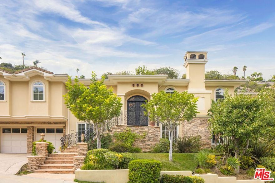 Tucked away within the prestigious enclave of "The Benedict Collection" at the southern tip of Sherman Oaks, this rare estate is one of only seven residences at the end of a tranquil cul-de-sac. Offering sweeping vistas of the San Fernando Valley and beyond, the home embodies timeless sophistication while celebrating the ease of indoor-outdoor California living.  The light-filled living room, anchored by a stately fireplace, flows effortlessly to a serene outdoor terrace with captivating city, mountain and lush green views.  An adjacent family room and dining room extend into the expansive kitchen and breakfast area, oriented toward the rear terrace and grassy yard ---complete with ample space for a pool.  The primary suite features a fireplace and generous bathroom, and connects to a versatile secondary bedroom ideal as a private office, retreat or gym.  The lower level is designed for both comfort and versatility, with four additional bedrooms, a spacious open lounge or play area, and a conveniently located laundry room. Direct access to the 4-car garage completes the thoughtful layout.  Blending privacy, elegance and views in a beautiful setting, this exceptional residence offers an unrivaled opportunity to own one of Sherman Oaks' most coveted addresses.