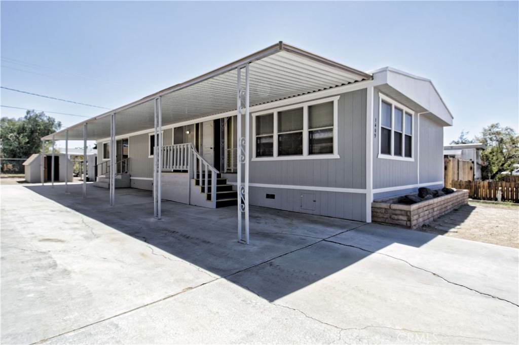 Seller is very motivated to sell. Welcome to 1409 W Upjohn Ave in Ridgecrest! This charming 3-bedroom, 2-bathroom home offers 1,440 sq ft of comfortable living space on a generous 6,534 sq ft lot. Step inside to find fresh new flooring, a bright, inviting layout, central heating, and a cozy pellet stove in the living room for added warmth and ambiance. The kitchen boasts a brand-new stovetop, while the home is equipped with a recently installed water heater for peace of mind. Outside, the property shines with all new siding, fresh exterior paint, beautiful window borders, and new window screens that enhance both curb appeal and efficiency. The backyard is designed for both work and play, featuring two powered storage sheds—perfect for projects, hobbies, or extra storage—as well as a newly built balcony to enjoy outdoor living. A 433A permanent foundation was recently completed, making the home financeable through standard loan programs. With all city services connected, you’ll have reliable utilities at your fingertips. This well-cared-for home blends updates with charm, offering a move-in-ready option in a convenient Ridgecrest location.