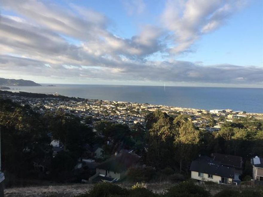 Stunning End-Unit Townhouse with Panoramic Ocean Views with 2 Pools (Indoors and Outdoor Pools) If you're searching for a Truly Exceptional Ocean View, this is one of the best in a community known for wonderful ocean views. From your couch, gaze all the way south to Pedro Point, beyond the Pacifica Pier sweeping, unobstructed coastal panorama that's rare to find. This bright and airy end-unit townhouse is filled with natural light, thanks to walls of windows and multiple skylights. Enjoy morning coffee or evening cocktails from three private outdoor spaces, each offering a different perspective of the ocean and surrounding beauty. On the first level, find 2 spacious bedrooms, 2.5 bathrooms, and 1,440 square feet of thoughtfully designed living space. The top is an open-concept living and dining area features elegant flooring, a cozy fireplace, and effortless flows and ideal for everyday living or entertaining. The well-appointed kitchen is ready for casual meals or special dinners. A dedicated laundry area adds daily convenience, while the oversized 2-car garage offers generous storage and parking. Community amenities include indoor and outdoor pools, perfect for year-round enjoyment.
