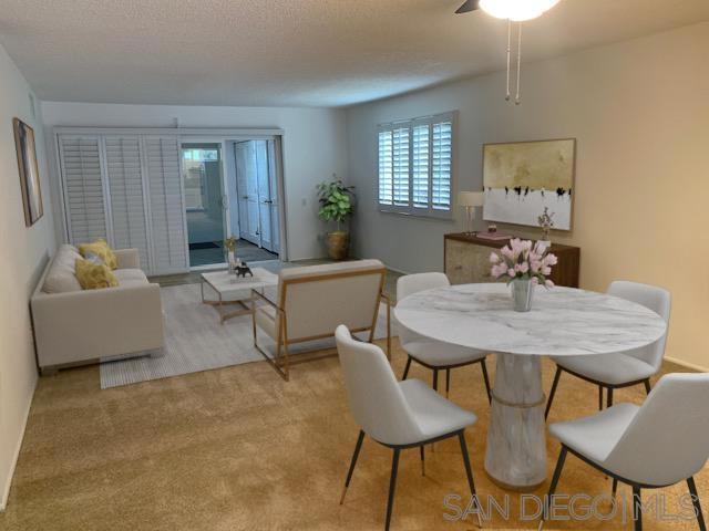 Welcome to this highly desirable 55+ light and bright single-level, 2-bedroom corner unit offering effortless living with no stairs to or within the home. This beautifully maintained condo features an updated kitchen with sleek stainless steel appliances, dual-pane windows and sliding doors, and elegant plantation shutters throughout. Bedroom 2 is equipped with a convenient Murphy bed and opens to an enclosed 11' x 11' patio addition, increasing your living space and providing a versatile area that includes a full-size washer and dryer. Enjoy your morning coffee or tend to your potted garden on the charming front walled patio—perfect for relaxing outdoors in privacy. Welcome to this highly desirable 55+ light and bright single-level, 2-bedroom corner unit offering effortless living with no stairs to or within the home. This beautifully maintained condo features an updated kitchen with sleek stainless steel appliances, dual-pane windows and sliding doors, and elegant plantation shutters throughout. Bedroom 2 is equipped with a convenient Murphy bed and opens to an enclosed 11' x 11' patio addition, increasing your living space and providing a versatile area that includes a full-size washer and dryer. Enjoy your morning coffee or tend to your potted garden on the charming front walled patio—perfect for relaxing outdoors in privacy.
