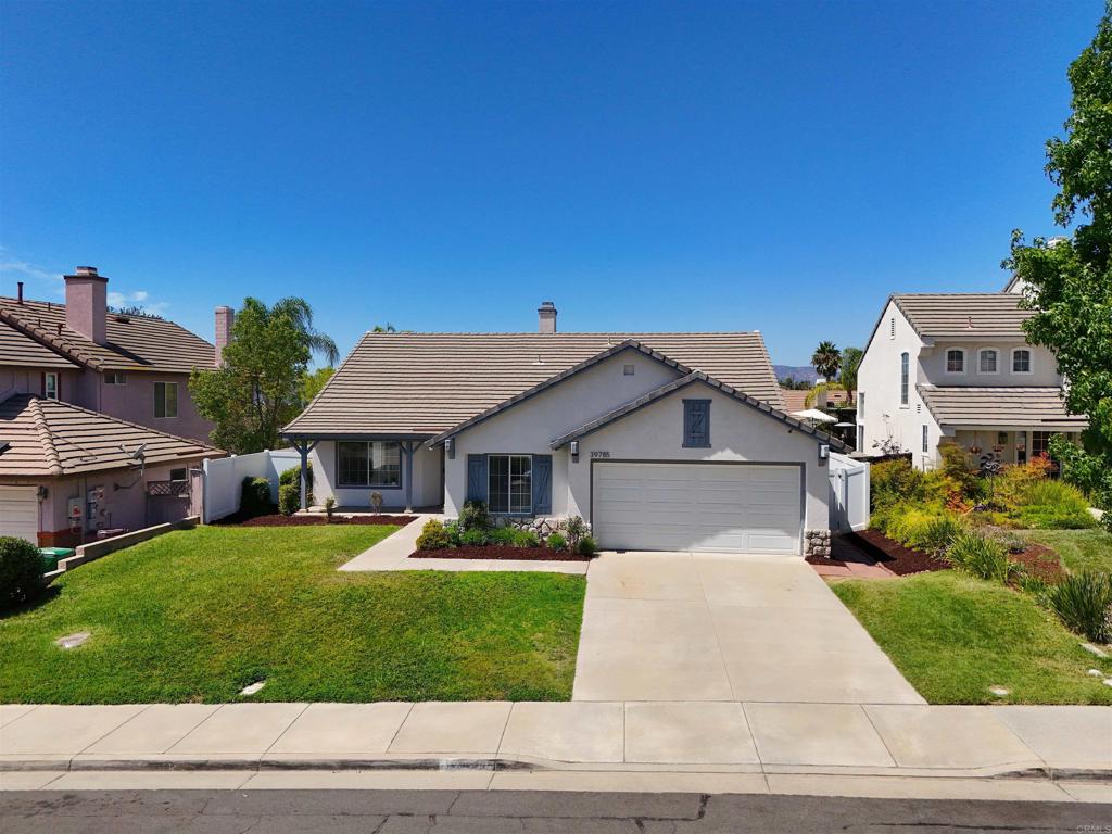 Welcome to 39785 Spinning Wheel Drive, a stunning single-story home tucked in the heart of Murrieta’s highly sought-after community. Offering 5 spacious bedrooms and 2.5 bathrooms, this residence blends comfort, functionality, and California living at it's best. Step inside to a bright and open floor plan, featuring high ceilings, abundant natural light, and a seamless flow between living spaces. The gourmet kitchen boasts granite countertops, ample cabinetry—perfect for everyday meals or entertaining. The adjoining family room with its cozy fireplace invites relaxation and gatherings. You’ll find the expansive primary suite with a spa-like en-suite bath, complete with a soaking tub, dual vanities, and walk-in closet. Additional bedrooms are generously sized, offering plenty of space for a family and guest. Outside, enjoy a beautifully landscaped backyard with a covered pergola and room for play, pets, or weekend barbecues. With no HOA and no Mello Roos, this home delivers value and freedom for it's next owner. Located just minutes from top-rated schools, shopping, dining, parks, and easy freeway access, this home combines convenience with the peace of a family-friendly neighborhood.