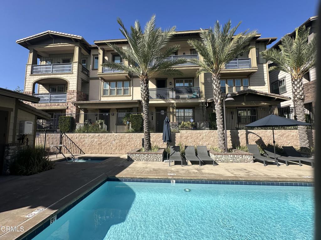 Nestled in Claremont, this hidden gem offers luxury living, energy efficiency, and wonderful amenities. Enjoy the outdoors peering out from the four balconies or patio with views of the mountains and sparkling pool. Gather loved ones around an outdoor fireplace beside the community barbecue and dining area. Entertain indoors in the great room that includes a spacious living area, an inviting dining space, and an expansive kitchen island. Prepare meals effortlessly in a modern kitchen equipped with stainless steel appliances, quartz countertops, and a sizable pantry. Retreat upstairs in private bedrooms with ensuite baths. Work downstairs or relax in an additional main-level bedroom with an adjoining full bath. Come home and park in your attached two-car garage with level-2 EV charging available at your disposal. Save on utilities costs with a whole house fan, tankless recirculating water heating system, and a smart thermostat. This low-maintenance home combines comfort and convenience within a delightful community in Claremont--a tree-lined city known for its parks, outdoor events, and exceptional public and private schools. Don't miss the opportunity to make this beautiful property your new home--schedule a tour today!