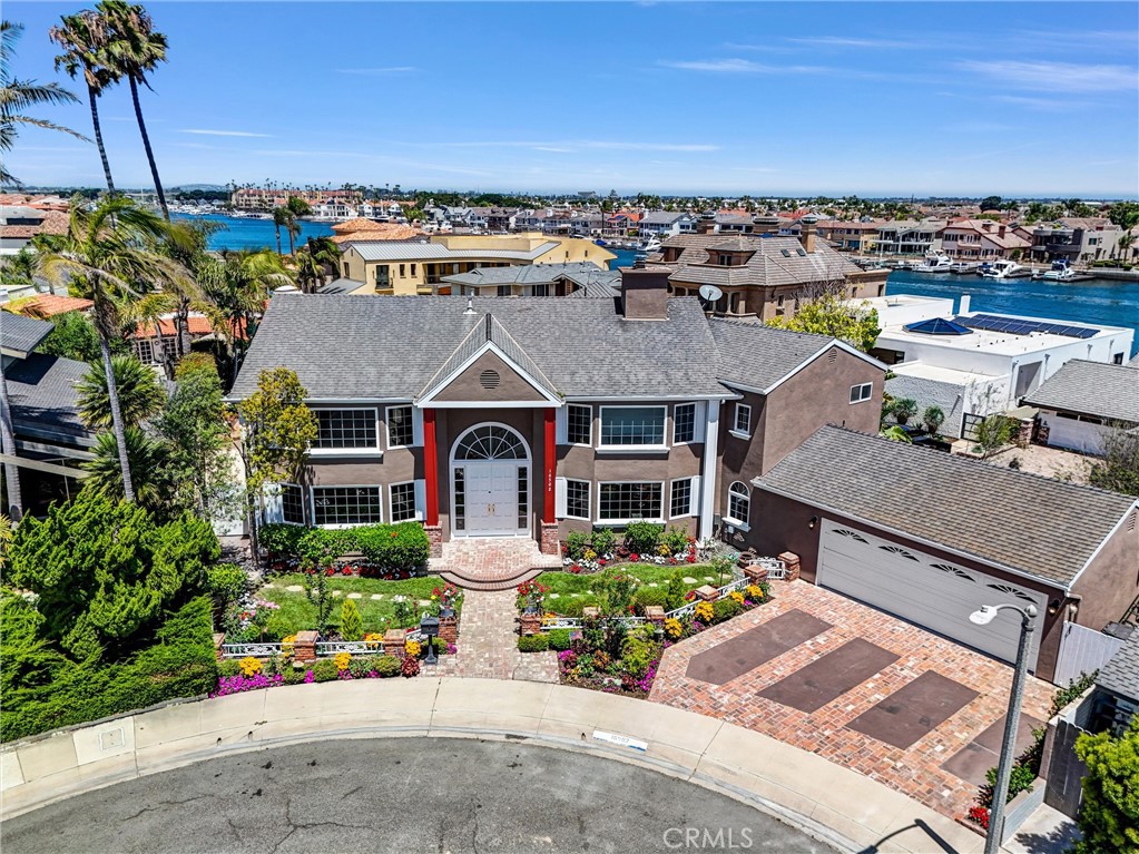 Perched at the highest point of Gilbert Island in prestigious Huntington Harbor, this show-stopping cul-de-sac estate offers nearly 4,400 square feet of refined coastal luxury. With 4 bedrooms (including a private main-level suite) and 4.5 bathrooms, the home combines elegant design with everyday comfort. Inside, enjoy formal living and family rooms, rich wood flooring, crown molding, and custom built-ins. The gourmet island kitchen features handcrafted cabinetry and upscale finishes—tailored for both entertaining and culinary excellence.
Step outside into your private resort-style backyard—complete with a sparkling pool, spa, built-in BBQ, lush tropical landscaping, and a convenient outdoor half-bath. Upstairs, the expansive primary suite delivers a true retreat with its own fireplace, spa-inspired bath, and dual walk-in closets.
Just steps from a tranquil community park and minutes from Bolsa Chica Beach, waterfront dining, and downtown Huntington and Seal Beach, this exceptional property captures the very best of luxury living in coastal Orange County.