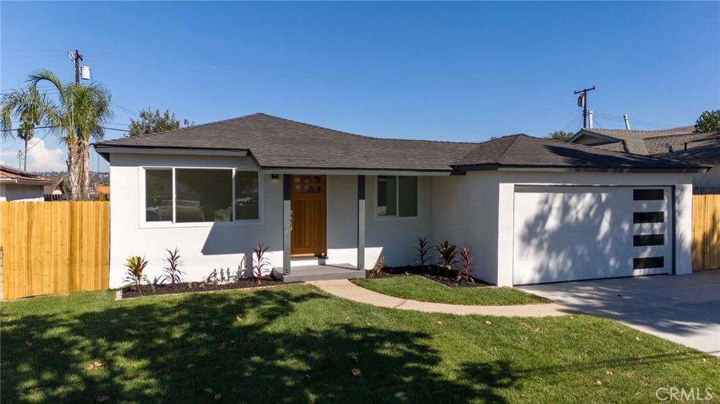 Welcome to this stunning, fully remodeled 4-bedroom, 2-bathroom home in the heart of Rowland Heights. Every inch has been thoughtfully updated with modern finishes, creating a move-in-ready oasis. The sleek exterior, manicured front lawn, and contemporary front door make an immediate impression. Inside, enjoy a bright open layout with new flooring, recessed lighting, and stylish bathrooms featuring designer tile work. The brand-new kitchen boasts quartz countertops, custom cabinetry, and a farmhouse sink. Step outside to a spacious, freshly landscaped backyard perfect for entertaining. Enjoy gorgeous views of the Puente Hills and an unbeatable location near the 60 and 57 freeways, shopping, fine dining, and top-ranked schools. This turnkey home offers comfort, convenience, and style all in one place.