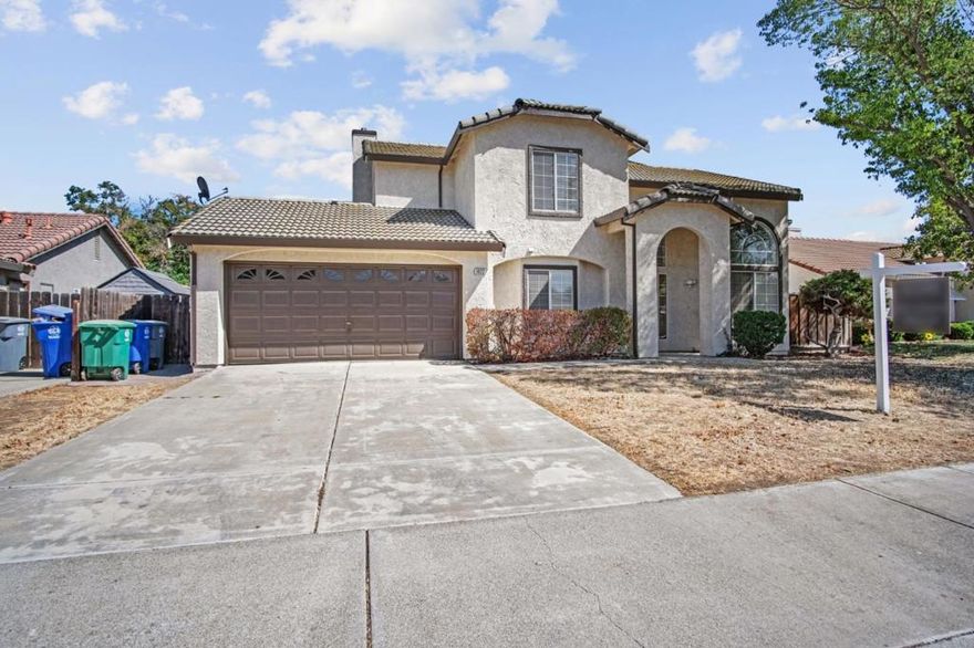 Welcome to this spacious 4-bedroom, 3-bathroom home located in the charming city of Los Banos. With 2,110 square feet of living space, this property offers ample room for family and entertainment. The heart of the home is the well-designed kitchen, seamlessly integrated with the family room, creating a perfect setting for gatherings. Enjoy cozy evenings by the fireplace, adding warmth and ambiance to your living space.  The home features a dining area that caters to both casual meals and formal dining occasions. Practical amenities include central AC and central forced air heating, ensuring comfort year-round. The property also boasts a convenient laundry area, making chores a breeze.  Situated on a generous lot, the exterior offers plenty of space for outdoor activities. The home falls within the Los Banos Unified School District, providing educational resources for families. With a two-car garage, this home meets all your needs for convenience and comfort in a sought-after location.