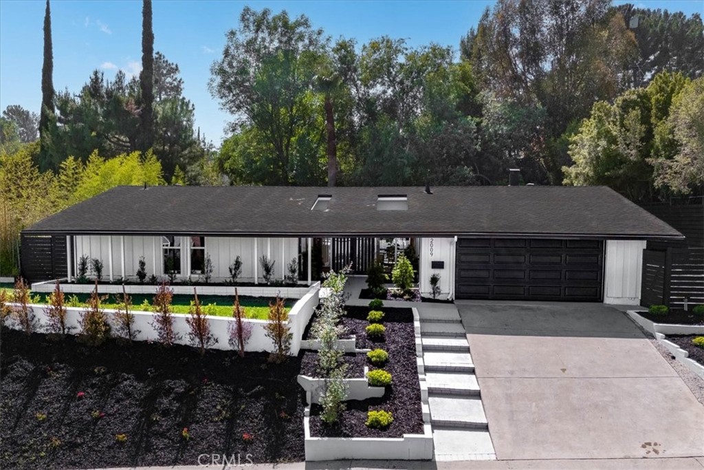 Welcome to this stunning single-story pool home, located in a prime Granada Hills neighborhood. Boasting modern elegance and thoughtful design, this property is a true gem. With the addition of a pool house in the backyard this home is an entertainer’s dream! From the moment you arrive, the lushly landscaped front yard and vibrant plants create a warm welcome. Step inside through double doors to discover a bright and open floor plan. The formal living area features a fireplace and expansive windows that fill the space with natural light, perfect for both relaxing and entertaining guests. The cozy dining room off the kitchen is perfect for hosting family and friends. The chef’s kitchen is equipped with stainless steel appliances, quartz counter tops and ample cabinets. The primary bedroom offers an updated ensuite bathroom, while two additional bedrooms share another beautifully renovated bathroom. This home has been meticulously updated with new flooring, windows, plumbing, electrical, interior and exterior doors, a garage door, sprinklers, fresh sod and newly planted trees for enhanced privacy. Additional features include a covered patio, that make outdoor living truly exceptional. The two-car garage offers ample storage and off-street parking - conveniently close to Great Schools, Shops, Restaurants & Easy Access to Freeway