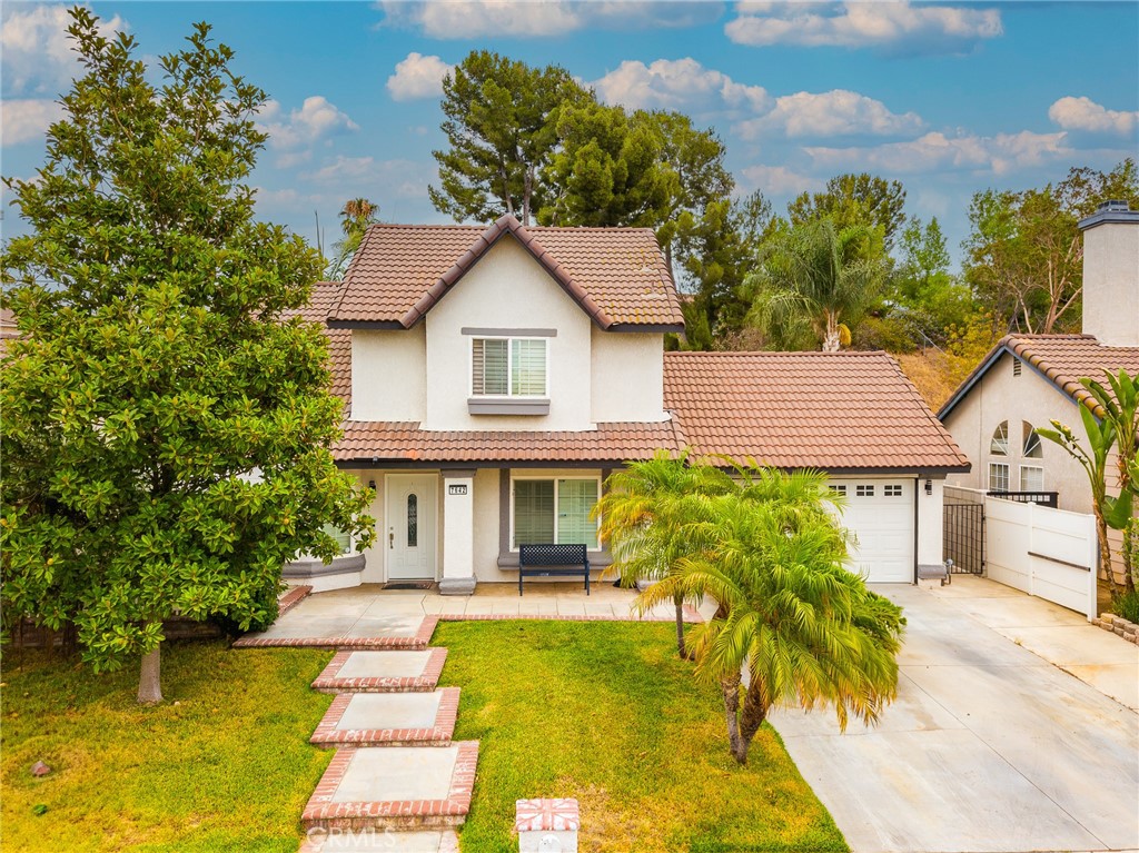 Nestled in a desirable Jurupa Valley neighborhood, this exceptional property presents a rare opportunity with its beautifully appointed main residence and ADU. Perfect for multi-generational families, frequent guests, or savvy investors seeking rental income, this home offers unparalleled flexibility and comfort. Step inside the main house and be greeted by a light-filled open floor plan, thoughtfully designed for modern living. The spacious living area, anchored by a charming brick fireplace, seamlessly transitions into a well-equipped kitchen and dining space – ideal for entertaining and everyday life. The master suite provides a private retreat, while additional bedrooms offer comfort and versatility. Escape to your own outdoor sanctuary! The expansive backyard is an entertainer's delight, featuring a refreshing swim spa perfect for year-round enjoyment, an inviting patio for al fresco dining, and a dedicated BBQ area for hosting gatherings. The beautifully landscaped grounds offer ample space for relaxation and play.
The separate ADU offers independent living with its own kitchen, living area, bedroom space, and bathroom – a fantastic asset for accommodating loved ones or generating extra income.