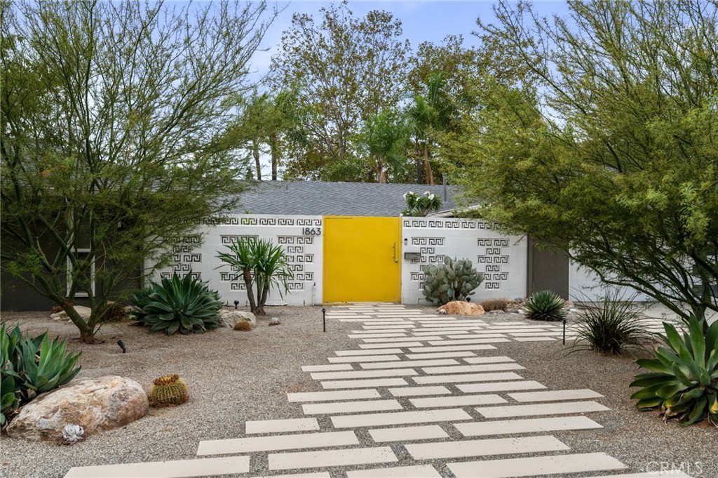 Welcome to 1863 Antioch Rd. This mid-century modern pool home in Indian Hills Estates has been tastefully updated with designer touches and modern features. The open kitchen was fully remodeled with custom cabinets and quartz counters. Walls of windows let natural light flow through the living and dining spaces. The single-level floorplan has four bedrooms and two and a half bathrooms, including a spacious primary suite. Other conveniences include a well-located laundry area, ample built-in storage, and attached two-car garage with EV charger. Enjoy fantastic curb appeal from the thoughtfully designed landscaping and distinctive yellow door, which leads into a peaceful courtyard with fountain. The large backyard features multiple zones to play and relax, including a swimming pool and a covered lounge area. The home is ideally set on a quiet cul de sac and steps away from Joat Park and Claremont High School. Come see it before it goes!