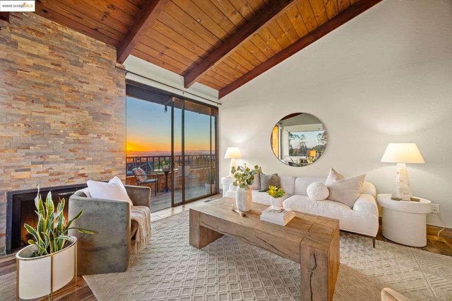 Located in Oakland’s desirable Crestmont neighborhood within the Redwood Hills HOA, 12 Sereno Circle is a beautifully designed tri-level townhome offering 2+ bedrooms, 2 bathrooms, and approx. 1,430 sq. ft. of light-filled living space. Featuring a primary suite with deck access and incredible iconic bay area views;  a lofted bonus room that serves as an office or 3rd bedroom option, an updated guest bath off the kitchen and next to the secondary bedroom, and a large 2 car garage with plenty of storage space. Also has air conditioning! An updated kitchen with large basin sink, stainless steel appliances that open up to a private patio round out the outdoor space. Recently updated exterior brown shingle siding. Enjoy panoramic views of San Francisco, the Bay Bridge, and the Golden Gate Bridge from multiple vantage points. Community amenities include a salt water pool and serene, landscaped grounds, and scenic walking path!