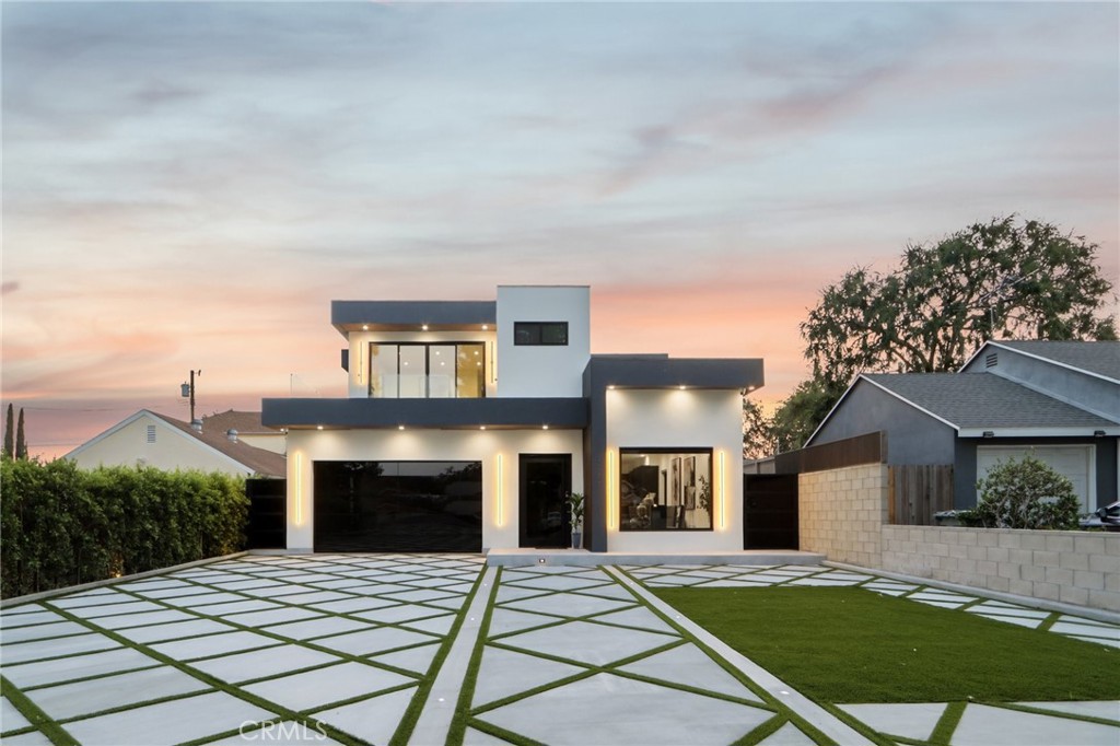 Burbank Show Stopper!!! True definition of Modern Elegance in every corner of this home inside & out. Walk in through the wide custom glass door and be amazed by the absolute beauty this Stunner has to offer. Just completed in (June 2025) with entertainers open floor plan featuring 4 bedrooms and 4.5 luxurious baths, large living room with beautiful large tile floors opens to the one of a kind slick & modern custom chef's kitchen with a huge center island and built-in appliances, high ceilings and recessed lighting throughout. The primary bedroom features a large private balcony, en-suite luxe bath with dual sink, floor to ceiling designer tile and a huge shower. Additional highlights include glass stair railings, designer interior doors, built-in surround sound, electric blinds, custom Italian accent wall finishes, engineered wood flooring upstairs, built-in security cameras, smooth stucco exterior, and elegant gold brass fixtures throughout. Large private back yard with patio and space for pool and entertainment. The curb appeal is off the chart, this home is truly unforgettable. Words and pictures simply don’t do it justice. This is one of those MUST SEE homes I promise there won't be any regrets.