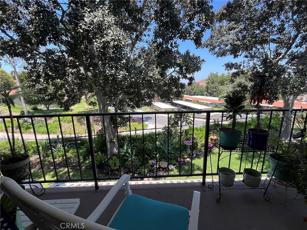 Welcome to Algarrobo! This nicely updated condo is located in one of the most highly desired senior communities in Orange County! This charming two-bedroom, two-bathroom condominium is situated on a single-loaded street surrounded by lush landscaping and boasts newer stainless steel appliances in the kitchen, along with updated flooring throughout the kitchen and bathrooms. This peaceful retreat offers a tasteful, neutral palate allowing its next lucky owner to easily make it their very own. Laguna Woods Village is a beautiful, twenty-four-hour guard-gated community providing unparalleled resort-style amenities to it's residents. Voted "Best Senior Living Community" by the Orange County Register, those who get to call it home enjoy the use of 5 pools, 4 hot pools, 7 clubhouses, 3 fitness centers, 10 tennis courts, 7 pickleball courts, 2 professional golf courses, an equestrian center, a performing arts center featuring an 814-seat theatre, and much more!!! Resident classes, continuing educational opportunities, and more than 200 active clubs will ensure that life here in Laguna Woods Village will benefit your mind, body, and spirit. Community transportation services offer a variety of options to meet your needs, whether you're partaking in onsite activities, running errands, or looking to venture out for a day of fun. This is more than a home, it's a lifestyle! Don't miss the opportunity to call this home!