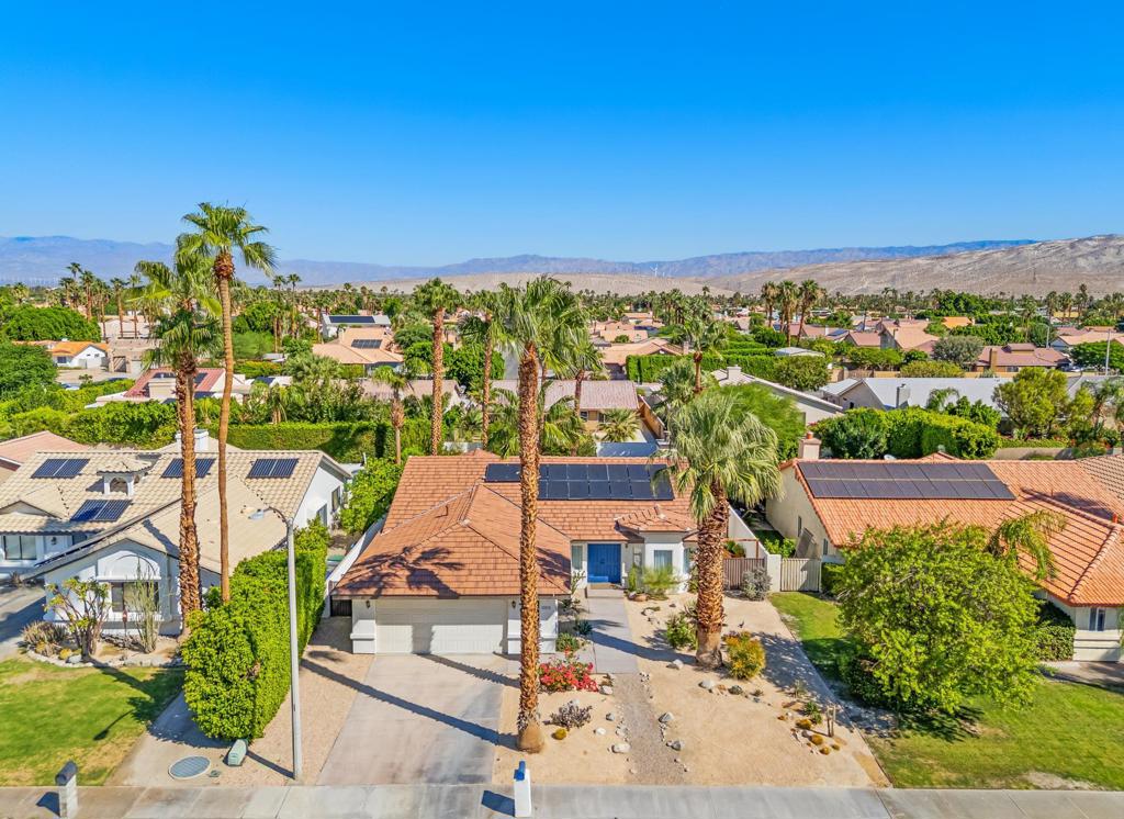 Move right into this beautifully updated 4bedroomss, 3-bath home with nearly 2,000 sq ft of living space, pool, and solar (leased). Sellers have spared no expense over the last few years: PebbleTec pool & spa remodel with new decking and lighting, brand-new roof (2025), new A/C & ducting (2020), and fresh interior/exterior paint (2025). The modern kitchen features new cabinetry and appliances, while bathrooms have been stylishly remodeled. Additional upgrades include new LVP flooring, custom closet wardrobes, smart irrigation with desert landscaping, EV charger outlet, and a removable pool fence. Situated on an oversized 7841+ sq ft lot, this home offers comfort, efficiency, and peace of mind with every major system replaced. Truly move-in ready and perfect for enjoying the desert lifestyle!