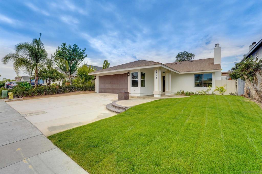 GORGEOUS single-level 4 bedroom-2 bathroom home that shines from start to finish! Large open great room style living with custom flooring, kitchen island, primary bed/bath w/ walk-in closet, new doors and windows, roof along with custom bathrooms! Attached 2 car garage, whole house heat/AC, fenced yard. Updated and revived with personal touches throughout! Truly a must see!! Oversized Kitchen that flows into the Living Room, perfect for large gatherings!