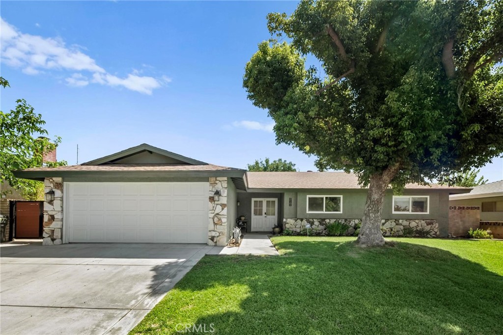 Welcome home to Lantana Avenue! Located in upper Yucaipa and loaded with upgrades, this one is sure to impress! Featured are: Almost 1700 sf if living space; 3 bedrooms and 2 bathrooms; As you come through the double door entryway, you are greeted with the spacious living room that included a wood burning fireplace; Down the hall to your left is the remodeled kitchen and dining room; The kitchen features white shaker cabinetry, granite composite sink, stainless steel appliances (gas range, microwave, dishwasher, and wine fridge!), custom backsplash, gorgeous counter tops, pendant lighting, and recessed lighting; The dining room is spacious and has a sliding glass door leading out to the covered patio and backyard; Down the hallway are the 2 guest bedrooms, full guest bathroom, and primary bedroom/bathroom; Primary bedroom also has a sliding glass door leading out to the covered patio and backyard. Bonus features include: Wood tile flooring, upgraded roof and HVAC system, ceiling fans, remodeled kitchen, 2-car garage, fencing/block walls/gates, grounds with mature landscaping, and so much more! Come and see for yourself....your new home awaits! Be sure to scroll down under features and checkout the virtual tours!