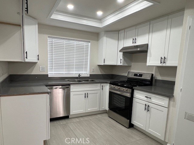 13772 Euclid St #3, Garden Grove-This beautifully renovated 2-bedroom, 2.5-bathroom apartment has been updated from floor to ceiling. Upon entering, you'll notice the new laminate flooring, recessed lighting, and fresh paint throughout. The kitchen boasts upgraded cabinets, granite countertops, new hardware, tile flooring, a stainless-steel sink, modern appliances, and more! The spacious living room is perfect for entertaining, complete with a ceiling fan. Upstairs, you'll find two primary suites, each featuring ceiling fans and renovated bathrooms one with a walk-in closet. Enjoy the fresh air from the private balcony. Additional features include blinds, crown molding, light fixtures, faucets, and mirrors. The property also includes a 2-car detached garage just steps away, offering overhead storage, along with access to a community laundry area. Owner pays for water and trash. Your home search is now over!
