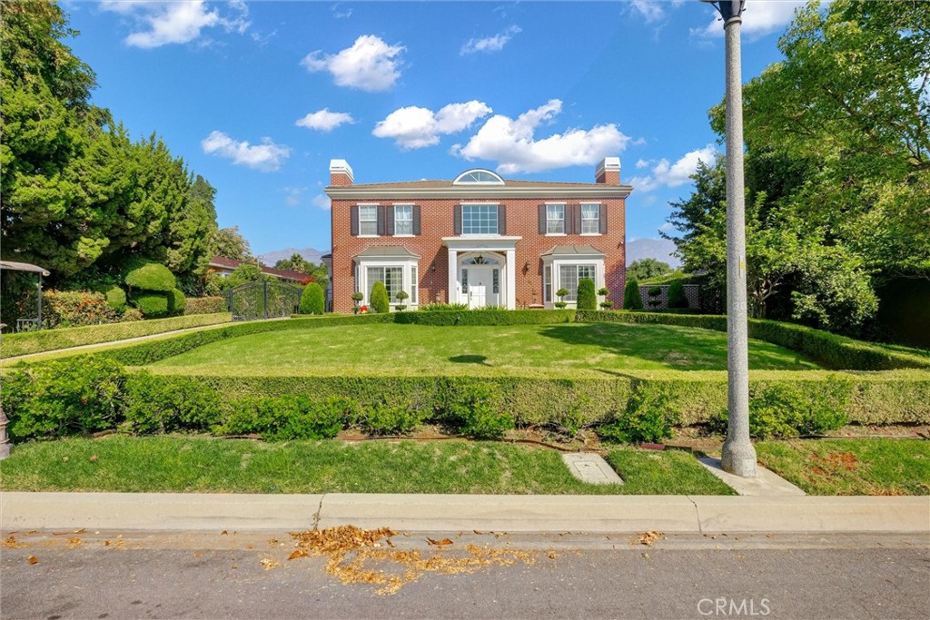 This timeless Georgian Colonial-style residence was completely rebuilt in 2008. It offers six bedrooms, six and a half bathrooms, and a detached three-car garage. Upon entering the grand foyer, you'll be welcomed by a stunning chandelier and a stenciled dome with ceilings reaching at least 20 feet high. To the right is a sophisticated library with custom-built cabinetry and a fireplace, creating a quiet space perfect for working from home. On the left is a stunning formal living room, adjacent to a elegant formal dining room framed by French doors, providing a picture-perfect setting for dinner parties with family and friends  The chef’s kitchen features a large marble center island, two warming drawers, a stainless-steel refrigerator and freezer, a six-burner gas stove, built-in microwave, double oven, and a wok kitchen equipped with a six-burner gas stove. The family room includes custom cabinets, a central AV console, and a full bar for entertaining. A wide staircase with art deco handrails leads to the second floor, where the master suite boasts its own bathroom and walk-in closet, with luxurious marble flooring and walls, a double sink vanity, Jacuzzi bathtub, steam shower, and a custom vanity dresser. The connected his-and-her offices feature a balcony overlooking the San Gabriel Mountains.
The home also includes a rare lower-level basement in Arcadia, which comprises a dance studio, entertainment room, game room, and a master suite with a marble shower, steam room, and custom-built cabinets with stained surfaces. This level is equipped with a bar, refrigerator, and freezer, with French doors leading to exterior stairs.  The backyard showcases a magnificent fountain and ample outdoor space, ideal for entertaining family and friends.  This property is located in a highly desirable Arcadia School District.
