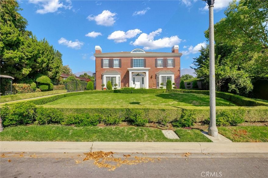 This timeless Georgian Colonial-style residence was completely rebuilt in 2008. It offers six bedrooms, six and a half bathrooms, and a detached three-car garage. Upon entering the grand foyer, you'll be welcomed by a stunning chandelier and a stenciled dome with ceilings reaching at least 20 feet high. To the right is a sophisticated library with custom-built cabinetry and a fireplace, creating a quiet space perfect for working from home. On the left is a stunning formal living room, adjacent to a elegant formal dining room framed by French doors, providing a picture-perfect setting for dinner parties with family and friends  The chef’s kitchen features a large marble center island, two warming drawers, a stainless-steel refrigerator and freezer, a six-burner gas stove, built-in microwave, double oven, and a wok kitchen equipped with a six-burner gas stove. The family room includes custom cabinets, a central AV console, and a full bar for entertaining. A wide staircase with art deco handrails leads to the second floor, where the master suite boasts its own bathroom and walk-in closet, with luxurious marble flooring and walls, a double sink vanity, Jacuzzi bathtub, steam shower, and a custom vanity dresser. The connected his-and-her offices feature a balcony overlooking the San Gabriel Mountains.
The home also includes a rare lower-level basement in Arcadia, which comprises a dance studio, entertainment room, game room, and a master suite with a marble shower, steam room, and custom-built cabinets with stained surfaces. This level is equipped with a bar, refrigerator, and freezer, with French doors leading to exterior stairs.  The backyard showcases a magnificent fountain and ample outdoor space, ideal for entertaining family and friends.  This property is located in a highly desirable Arcadia School District.