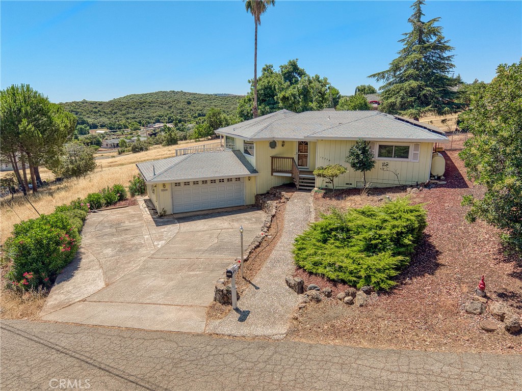 Big Air Conditioner ! Great house with vaulted round wood ceiling, windows seem newer and has blinds throughout, cute old bar, fun, private covered back deck to the old golf greens (no house behind), chain link FENCED backyard, storage under deck, extra parking next to garage (motorhome or boat). Quiet Cul de sac, near the Konocti Hills Restaurant. 2 full baths, laundry inside. Stairs up from garage but house and deck are one level. Sunrun solar leased. There is a chimney from old woodstove, new law, cannot have wood heat in "new" construction in CA so this is a plus. Monitor heater as well.
Come take a look!