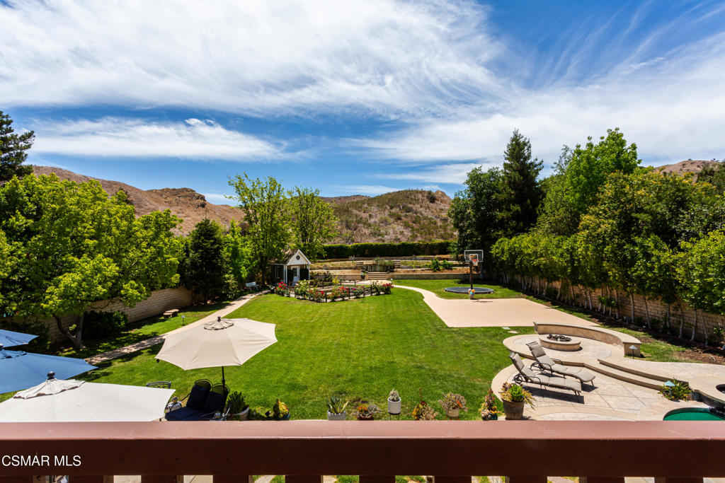 Luxury Living in The Oaks at Wood Ranch - A Rare and Prestigious OpportunityWelcome to The Oaks at Wood Ranch, one of Simi Valley's most exclusive gated communities, where luxury meets tranquility. This expansive estate offers over 3,800 square feet of beautifully appointed living space, thoughtfully designed for comfort, style, and entertaining.Situated on a flat half-acre lot, the backyard is truly a showstopper--offering endless potential to create your own private retreat, from a tropical oasis to a custom ADU, or even your own outdoor recreation paradise. Enjoy the sparkling pool, built-in barbecue, gas fire pit, sitting wall, and half-court basketball area, all framed by the natural beauty of the Santa Monica Mountain Range.Inside, the home showcases premium finishes including rich hardwood floors, granite countertops, crown molding, and custom wood shutters. The chef's kitchen features high-end Viking stainless steel appliances and a Sub-Zero refrigerator, ideal for culinary enthusiasts and entertaining guests alike.Wake up each morning to breathtaking viewsfrom the main suite and unwind on your private balcony, where the surrounding hills provide a serene backdrop. The main suite also includes a spa-inspired en suite bathroom and spacious walk-in closets.Additional highlights include: Newly installed solar system Open-concept living and family rooms with scenic views Proximity to Long Canyon hiking and biking trails Near Wood Ranch Country Club, Wood Ranch Elementary, and local parks Just minutes from upscale dining, shopping, and the Ronald Reagan Presidential Library Don't miss your chance to own a piece of paradise in one of Simi Valley's most coveted communities.