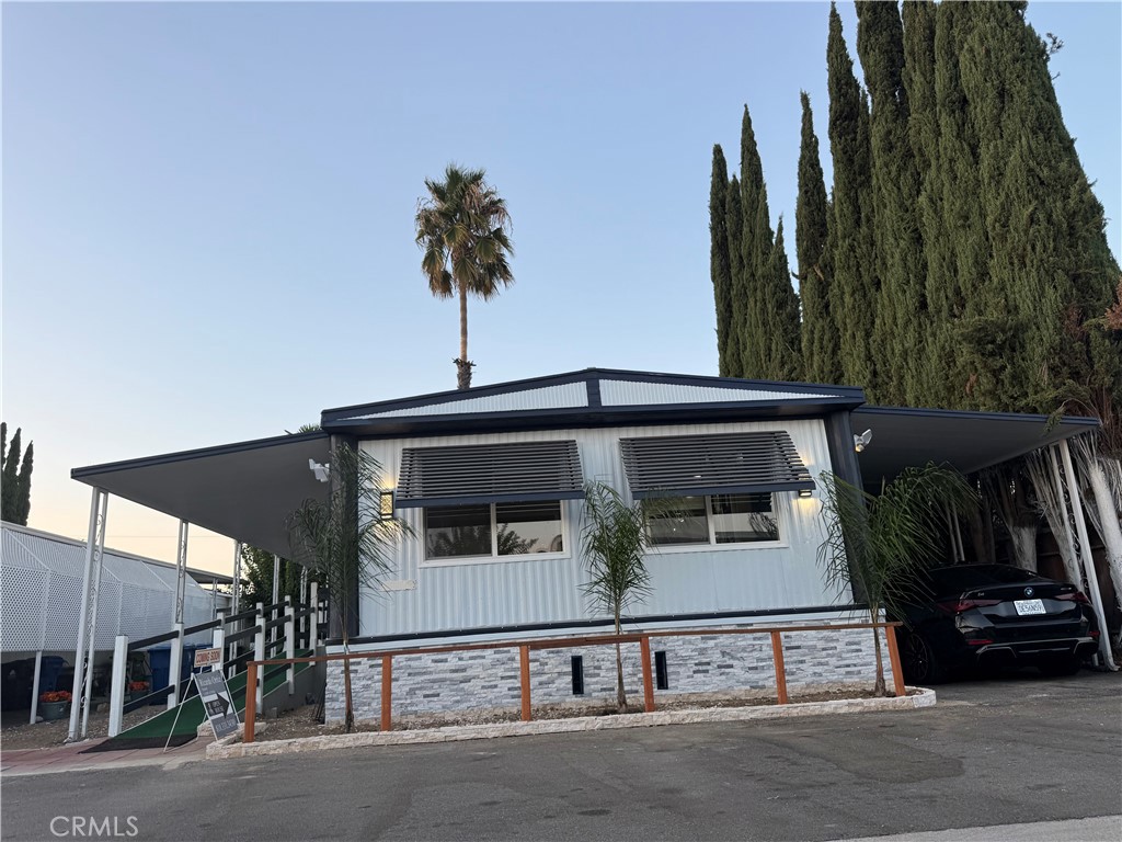 LOCATION, LOCATION, LOCATION! 8801 ETON AVENUE SPACE 64, Canoga Park, CA 91304 MESMERIZING, AND ENCHANTING HOME. TOTALLY REMODELED HOME! WONDERFULLY & AMAZINGLY REDONE. WOW! A COMPLETE TRANSFORMATION HAS BEEN PERFORMED IN THE HOUSE! New kitchen with a huge quartz countertops' ISLAND! New 100% waterproof flooring throughout the whole house. This beautiful and renovated home has 2 bedrooms with huge closets (one BEDROOM has 2 CLOSETS). Let your imagination fly and think what you could do with an extra potential room due to the space lot, it is big! The home has New painting inside and outside. 2 completely REMODELED BATHROOMS. The master’s bathroom is HUGE for a great hot shower/relaxing time! Each bathroom has a CONVENIENT BUILT IN BENCH INSIDE THE SHOWER WITH GRAB BAR'S SHOWER TOO. The entire house has CROWN MOLDING. THE ALL All 10 UPGRADED, BRAND NEW windows are LOW “E3 TINTED”, RETROFIT, DUAL GLAZED & ARGON FILLED UP. The whole house has recessed LED LIGHTING. Brand New Stove, Newer Refrigerator, Brand New Microwave and Brand New Range Hood. Brand New Doors. All these NEW things are awaiting for a BRAND NEW FAMILY OWNER. Come and see it today! Make the appointment with the agent as soon as possible, thank you!