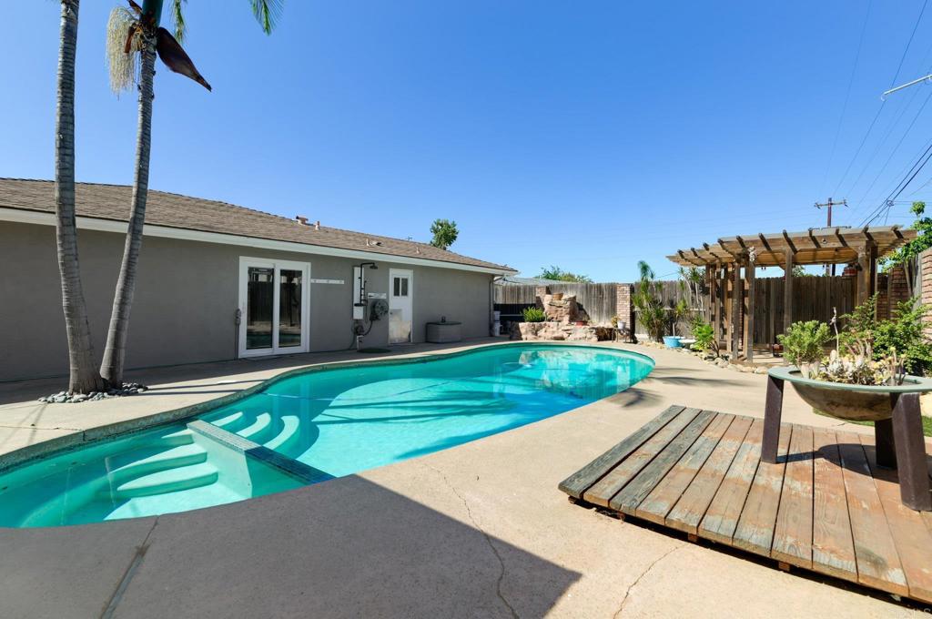 Amazing location! Walking distance to the Historic Main Avenue in Fallbrook! Be right near the action for Avocado Festival, Harvest Faire, Vintage Car Show, Farmer’s Markets, and everything Downtown Fallbrook has to offer. This home is incredibly spacious, featuring a bonus room that’s flexible enough to serve as a gym, home office, playroom, or second living room. With a total of two oversized living areas, the home itself has a ton of space. The large open kitchen is perfectly situated in the home and has lots of cabinet storage, including a pantry. Fun and relaxing backyard area with a pool, spa, gazebo, outdoor shower, and plenty of sitting areas. Additional highlights include a brand new AC, a custom-built garage with clever storage and design that adds unique privacy to the front yard, fruit trees on property, and ambient outdoor lighting. Between the awesome pool area, bonus home, and incredible location, this home is a must see!
