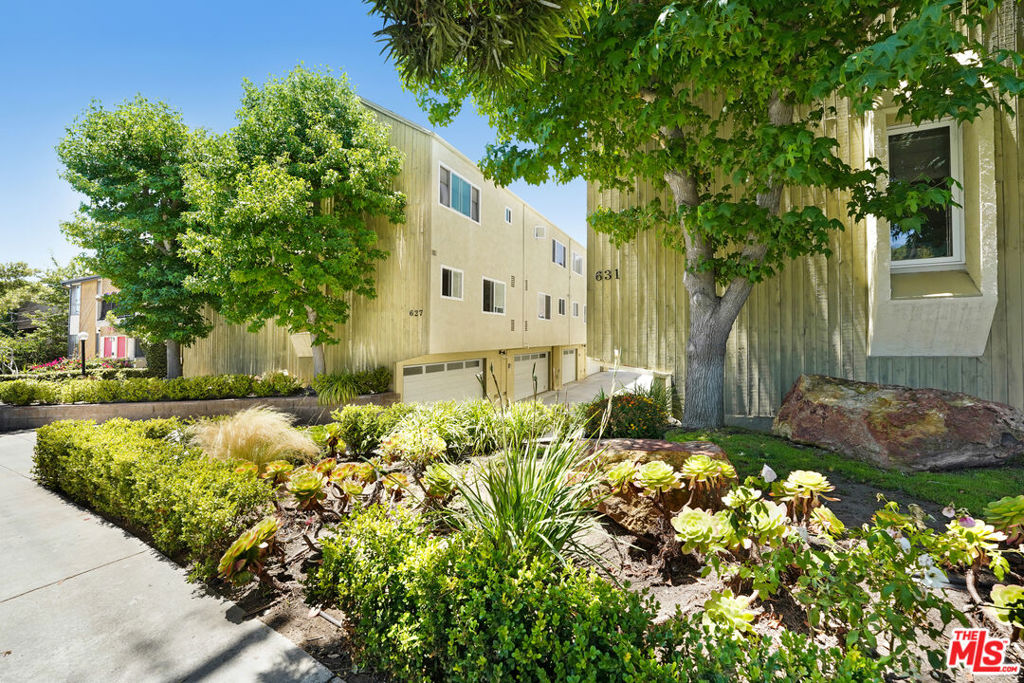 REDUCED!!! This is a rare opportunity to own a beautifully designed tri-level, end-unit townhouse in one of Santa Monica's most coveted neighborhoods, Ocean Park. Bathed in natural light and ocean breezes year-round, this bright and spacious home offers approx. 1,328 sq. ft. of living space. Featuring 2 bedrooms, 2.5 bathrooms, the formal entry leads into a warm and inviting, split level living area with wood floors, recessed lighting, and plantation shutters that include a private patio, ideal for relaxing mornings and nights. Downstairs has private direct-access to 2-car garage, with updated epoxy floor, washer, dryer, plus a bonus room for creative space or additional storage. Upstairs, the grand primary suite boasts city and sky views from its Juliet balcony, making it the perfect place to unwind before bed and enjoy the eastern sunrise. The second bedroom faces the ocean, offering incredible breezes and a serene coastal vibe. Modern comforts include central air and heat, and a tankless water heater for energy efficiency. Windows have been replaced with dual paned vinyl windows. Located just 1/2 mile to the beach and only blocks from vibrant Main Street with its shops, dining, and galleries. Enjoy Joslyn Park, which is across the street, offering green space, playground, dog park, community events, and tranquil outdoor moments. All within the award-winning Santa Monica-Malibu Unified School District. Act fast, townhomes like this in Ocean Park rarely come available. This is your chance to experience the best of Southern California living. Don't miss out on this rare Ocean Park gem!
