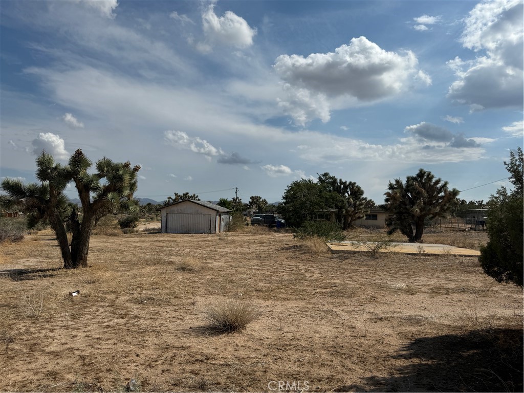 Looking for the perfect site to build your desert retreat or investment property? This 0.75-acre lot in the Yucca Valley area is packed with potential and already includes valuable improvements to save you time and money. The property comes with a prepaid water meter, electrical pole with transformer at the corner of the lot, and a septic tank in place—a solid start for your next project. Unique to this parcel is an existing garage structure (may need extensive work) and a concrete pad, giving you additional flexibility for storage, renovation, or as a base for new construction. The lot’s generous size provides plenty of space for a custom home, guest house, or desert getaway with room for RVs, outdoor living, and more. Conveniently located near Joshua Tree National Park, Yucca Valley, and Pioneertown, this property offers easy access to local dining, shopping, music venues, and endless outdoor adventure. Whether you’re a builder, investor, or buyer ready to design your desert lifestyle, this is an opportunity you don’t want to miss. Call today to schedule a showing and explore the possibilities!