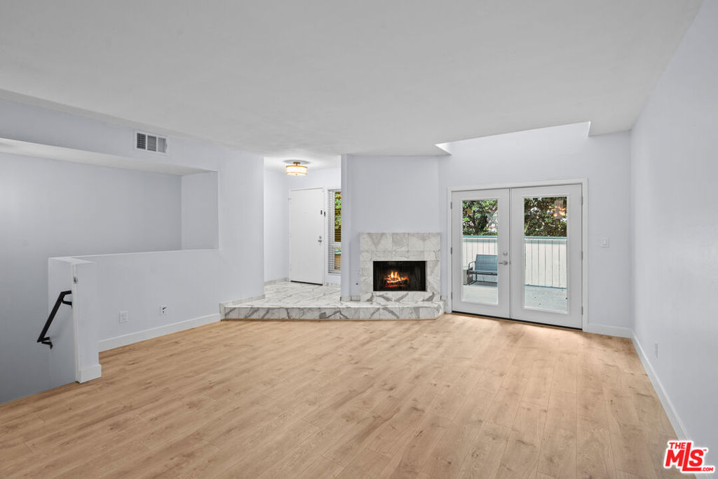 Welcome to this spacious and well-maintained 3-bedroom, 3-bathroom townhouse located in the heart of Canoga Park, just minutes from Westfield Topanga Mall and The Village. This multi-level home offers over 1,626 sq ft of comfortable living space, featuring a rare 3-car garage with direct access, in-unit washer and dryer, and two generous private patios, one off the main living area and another off the primary suite. Inside, you'll find a bright and open floor plan with a cozy fireplace in the living room, ideal for relaxing or entertaining. The dining area flows seamlessly into the kitchen with ample storage and counter space. Upstairs, the primary suite includes a walk-in closet, en suite bath, and doors leading to a private patio retreat. Additional highlights include two secondary bedrooms with ample natural light, central HVAC, and plenty of storage throughout. This home is located close to major shopping, dining, and freeway access. Whether you're looking for convenience, space, or lifestyle this townhouse has it all.