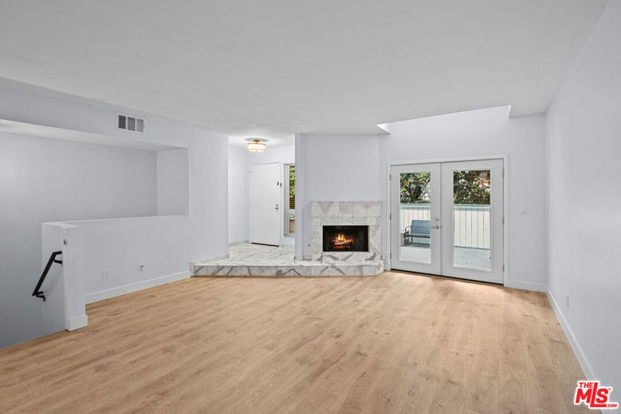 Welcome to this spacious and well-maintained 3-bedroom, 3-bathroom townhouse located in the heart of Canoga Park, just minutes from Westfield Topanga Mall and The Village. This multi-level home offers over 1,626 sq ft of comfortable living space, featuring a rare 3-car garage with direct access, in-unit washer and dryer, and two generous private patios, one off the main living area and another off the primary suite. Inside, you'll find a bright and open floor plan with a cozy fireplace in the living room, ideal for relaxing or entertaining. The dining area flows seamlessly into the kitchen with ample storage and counter space. Upstairs, the primary suite includes a walk-in closet, en suite bath, and doors leading to a private patio retreat. Additional highlights include two secondary bedrooms with ample natural light, central HVAC, and plenty of storage throughout. This home is located close to major shopping, dining, and freeway access. Whether you're looking for convenience, space, or lifestyle  this townhouse has it all.