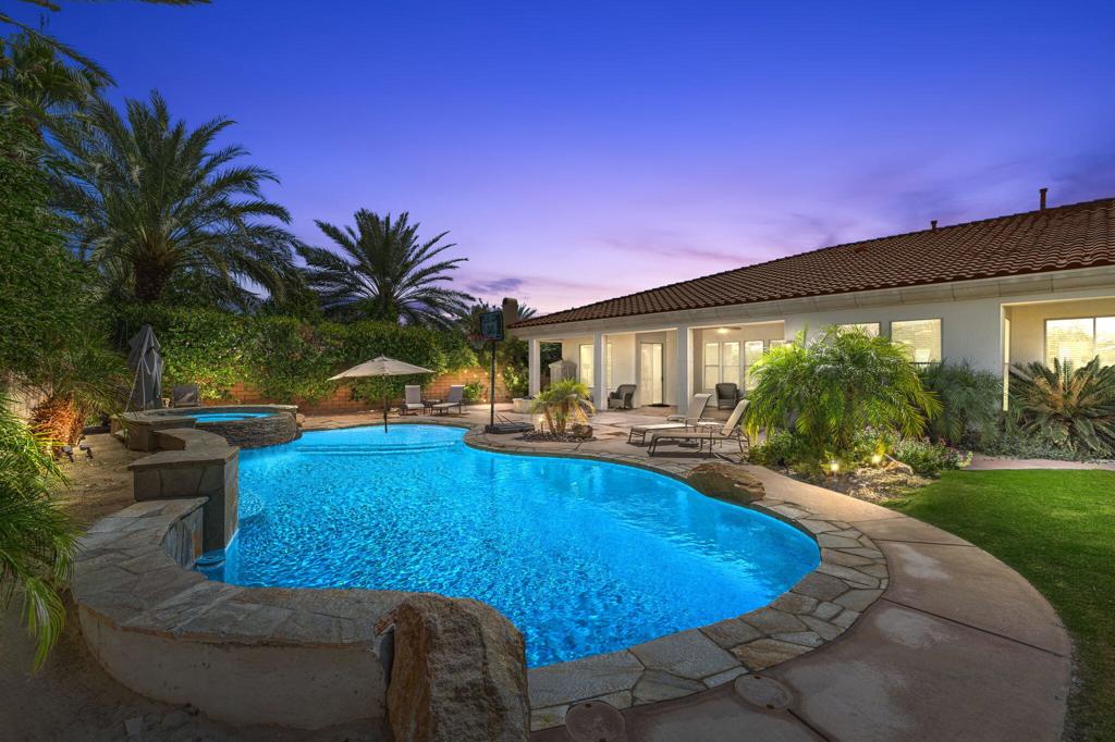 Welcome to this stunning 4-bedroom, 5-bathroom estate located in the highly sought-after gated community of Talante in La Quinta. Offering 3,640 sq. ft. of elegant living space, this home boasts a desirable split floorplan with four en suite bedrooms, each featuring its own walk-in closet, ensuring comfort and privacy for all. From the moment you arrive, you'll be impressed by the upgraded wrought iron double door entry and striking curb appeal. Step inside to find travertine flooring, coffered ceilings, and a layout designed for both grand entertaining and relaxed everyday living including a formal dining room and sun room off the master suite. Situated on a generous cul-de-sac lot, the beautifully landscaped backyard is an entertainer's dream with a newly built pool, perfect for enjoying warm desert days. Additional highlights include a spacious 3-car garage, low HOA dues, and a prime location close to the Empire Polo Grounds, Indian Wells Tennis Garden, world-class golf courses, fine dining, shopping, and top-tier entertainment. This exquisite Talante home truly blends luxury, privacy, and convenience--a rare opportunity in the heart of La Quinta.