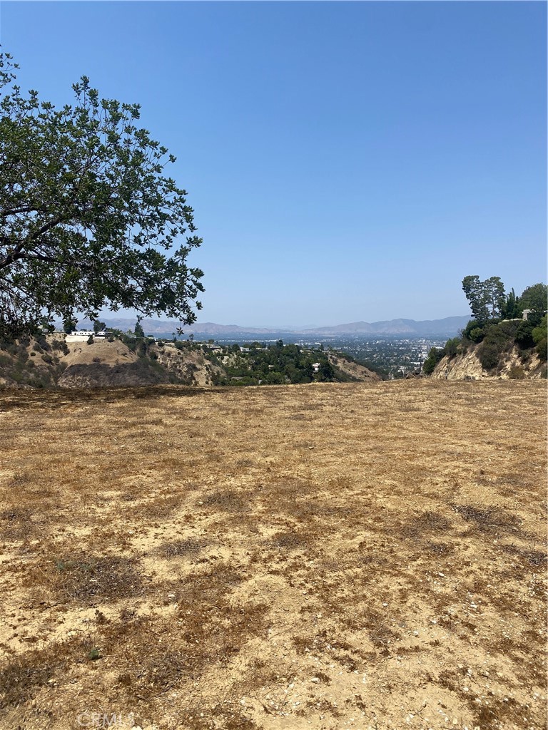 Presenting, a rare and superb opportunity to build two beautiful masterpieces! This lot includes frontage to Beverly Glen and has expansive views of Sherman Oaks and Studio City hills, city lights and night, just stunning!
This lot is sold together with the adjoining parcel, and the two lots should be re-drawn at the city in order to build two homes. The City of LA also should grant access to the lots from "No Name" drive. If a developer is willing to take on those tasks, the payoff will be well worth it. The two lots would each command incredible valley and city lights views. The neighborhood boasts stunning large estates among the rolling hills with large oak trees. This is an incredible opportunity to pick up these two lots, and create two rare and superb masterpieces.
