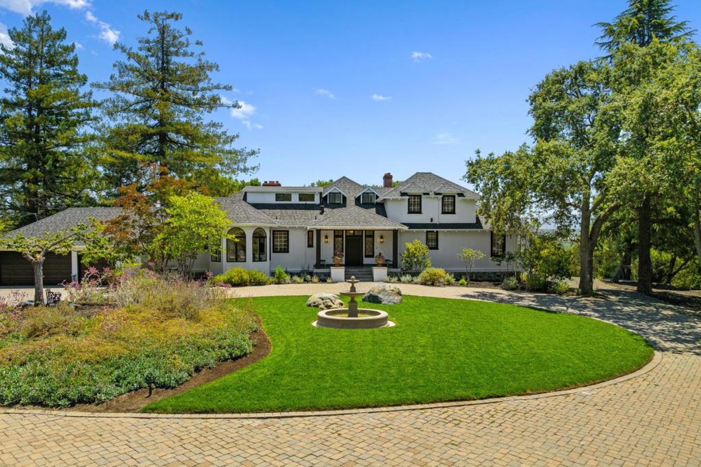 Discover this exceptional opportunity to own a generational estate spanning 7 acres across 3 separate parcels, each with its own APN. Through a private gate & down a long winding driveway, you are greeted by a circular motor court with incredible views of the Santa Cruz Mountains. The main residence offers 4,340 sqft featuring 6 beds & 5.5 baths, with exceptional upgrades throughout. On the east side of the property there is a large building pad; once the site of a horse stable, recently prepared for development. This pad is situated on the border of 2 of the 3 parcels & includes direct access from Moore Rd via a natural pathway. Nestled on the western edge of the property with its own private gate is a 2k sqft guest house boasting high ceilings, 2 beds & 1 bath - all opening out to an infinity-edge pool surrounded by lush landscaping. Winding pathways connect this serene retreat to the rest of the estate. This is a truly versatile offering with significant future upside through lot line adjustments, possible subdivision, or exploring SB9 opportunities. A unique & rare chance to create a lasting legacy in one of the most coveted zip codes in the country. Designated under the Las Lomitas school district with proximity to private institutions such as Sacred Heart & Woodside Priory.