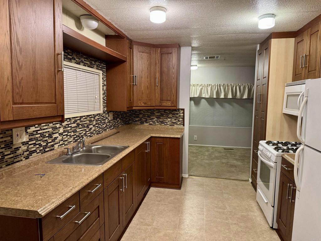 STUNNING 3 Br 2 Ba - Turnkey Beautiful Manufactured Home in So. Bay's Finest Community - Highly Sought After Otay Lakes Lodge. Eastlakes ONLY MH Park. 55 years & up - 45 years for significant other. Please contact Park Management to get pre-approved for purchase. Double Wide & Extra Long w/3 Spacious Bedrooms & Large Living & Family Rooms. Gorgeous Kitchen, Newer Appliances with Top Line cabinetry & tasteful kitchen counters. Drywall finish in All front rooms. Laundry Room w/Washer/Dryer included. Great California Room off front entry for relaxing with a cold beverage. EZ Walk to the wonderful pool, rec room, shuffleboard courts & horse show pits. Large Green Grassy areas, perfect for dog walking. Wonderful EastLake Location w/Shopping Galore, Movie Theatres nearby, Restaurants, Fine Dining & ALL This Wonderful Community has to offer.
