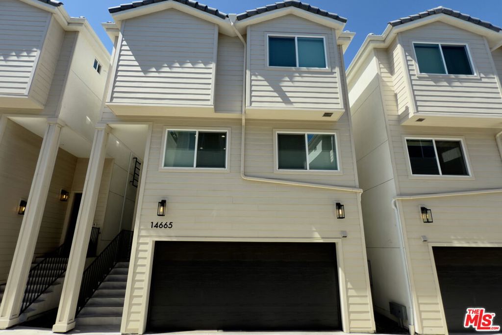 QUALIFIES FOR THE COMMUNITY ADVANTAGE LENDING PROGRAM! - 2% BACK TO BUYER + $1500 BACK FOR CLOSING COSTS, NO PMI, AS LITTLE AS 3% DOWN, RATES IN THE MID 5%'s: FOR ANY BUYER!!! Step into your modern dream home, an impeccably designed, small-lot new construction residence nestled within a gated community in the vibrant metropolitan hub of Panorama City, Los Angeles. Spanning three levels, this contemporary masterpiece offers the perfect blend of style, functionality, and comfort. Boasting 3 spacious bedrooms, 3 full bathrooms, and a versatile flex space ideal for a home office or creative studio, this home is tailored to meet the demands of modern urban living. The open-concept layout flows effortlessly from room to room, enhanced by abundant natural light and high ceilings that add to the airy, expansive feel. Every detail has been carefully curated to reflect contemporary luxury from the high-quality laminate flooring that runs throughout the main living spaces to the sleek stainless steel appliances in the chef-inspired kitchen. Whether you're entertaining guests or enjoying a quiet night in, the design and finishes speak to refined taste and everyday elegance.Enjoy the convenience of a private patio, perfect for morning coffee, alfresco dining, or a serene moment outdoors. Tech-forward amenities include a Level 2 EV charger, fiber optic pre-wiring for ultra-fast internet, and a pre-run conduit for solar installation, offering both sustainability and future-ready infrastructure along with the transferable builder warranty. Situated across from Tobias Avenue Park, you'll have green space just steps from your front door. Daily essentials are never far, with nearby access to grocery stores, shopping centers, and diverse restaurants. Commuting is a breeze with quick access to the 405, 118, and 5 freeways, connecting you easily to the rest of Los Angeles. Whether you're a first-time buyer, investor, or looking to upgrade your lifestyle, this home is a modern sanctuary crafted for convenience, beauty, and high-performance living. Don't miss your chance to own this piece of contemporary paradise.