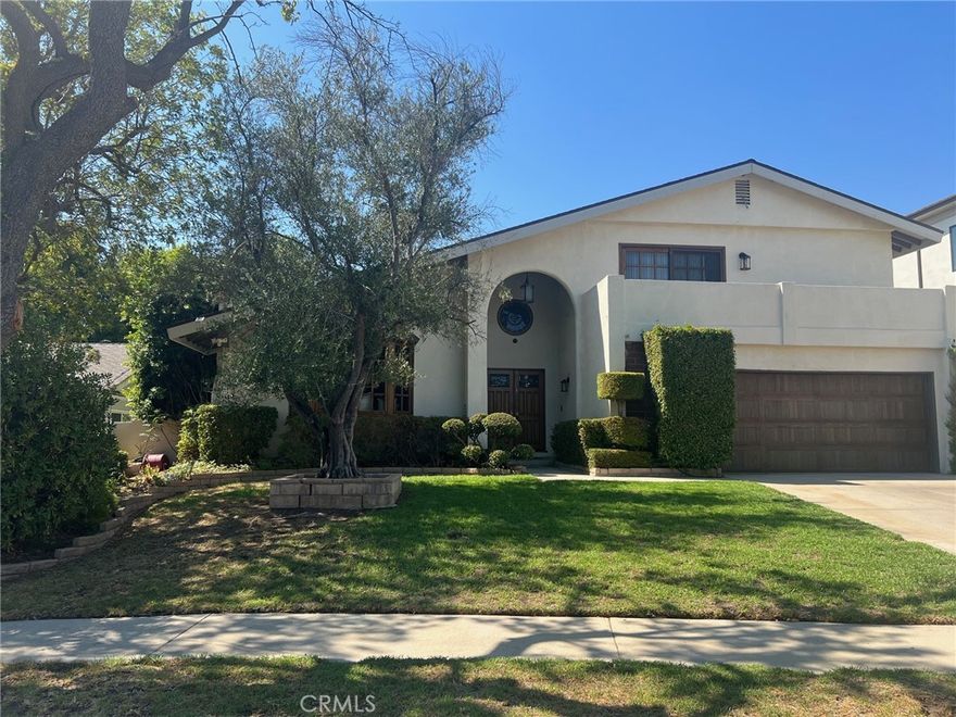 Welcome to this 4 bedroom, 3 bath, nearly 2300 sq. ft. home nestled in one of Chatsworth most sought after neighborhoods. The spacious living room boasts high celling, bay window, and cozy fireplace with a custom mantel and stone hearth. The step down dining room has a bay window and wood type flooring. Light filled, tiled kitchen with a convenient breakfast area, newer Samsung appliances (microwave, stove, and dishwasher), large pantry and beautiful plantation shutters. The cozy family room offers wood type flooring, beamed ceiling, built-in desk area, wet bar, and floor to ceiling plantation shutters. The main level offers a full bedroom and bath, perfect for guests or home office. Upstairs the oversized primary suite offers a private balcony - perfect for your morning coffee, a large walk in closet, plus a secondary closet. Additional highlights include a two-car direct access attached garage. Newer central heat/air and newer roof. The expansive backyard is ready for entertaining with a covered Patio and sparkling pool. The desirable Chatsworth location has it all. Close proximity to the Vineyards shopping center, which offers a wonderful choice of restaurants, Whole Foods market, and a movie theater. With nearby hiking trails, great schools, parks and easy freeway access, this one is not to be missed!