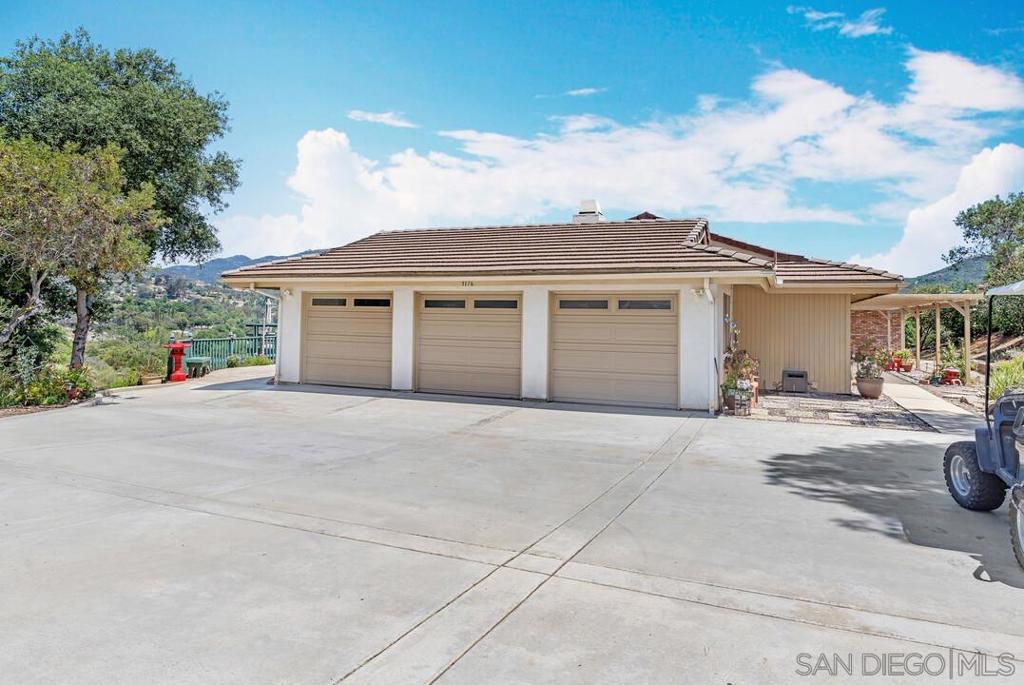 Come see this beautiful single-level, custom-built ranch-style home nestled in the highly sought-after Palo Verde Ranch community. Situated on a private 2+ acre lot, this property offers breathtaking mountain views and endless possibilities for outdoor living. This spacious 4-bedroom, 2.5-bath home features a warm and inviting open-beam family room with vaulted ceilings, a cozy fireplace in both the living and family rooms, and multiple comfortable seating areas. The kitchen is well-appointed with a cooktop, separate oven, and generous counter space—perfect for both everyday living and entertaining. Step outside to enjoy the built-in BBQ and expansive yard with ample room to build an ADU, install a pool, or even add a stable—thanks to equestrian zoning. The 3-car garage provides abundant storage for vehicles, equipment, or recreational gear. Don't miss this rare opportunity to own a serene, spacious property with so much potential in one of East County’s premier communities. Come see this beautiful single-level, custom-built ranch-style home nestled in the highly sought-after Palo Verde Ranch community. Situated on a private 2+ acre lot, this property offers breathtaking mountain views and endless possibilities for outdoor living. This spacious 4-bedroom, 2.5-bath home features a warm and inviting open-beam family room with vaulted ceilings, a cozy fireplace in both the living and family rooms, and multiple comfortable seating areas. The kitchen is well-appointed with a cooktop, separate oven, and generous counter space—perfect for both everyday living and entertaining. Step outside to enjoy the built-in BBQ and expansive yard with ample room to build an ADU, install a pool, or even add a stable—thanks to equestrian zoning. The 3-car garage provides abundant storage for vehicles, equipment, or recreational gear. Don't miss this rare opportunity to own a serene, spacious property with so much potential in one of East County’s premier communities.