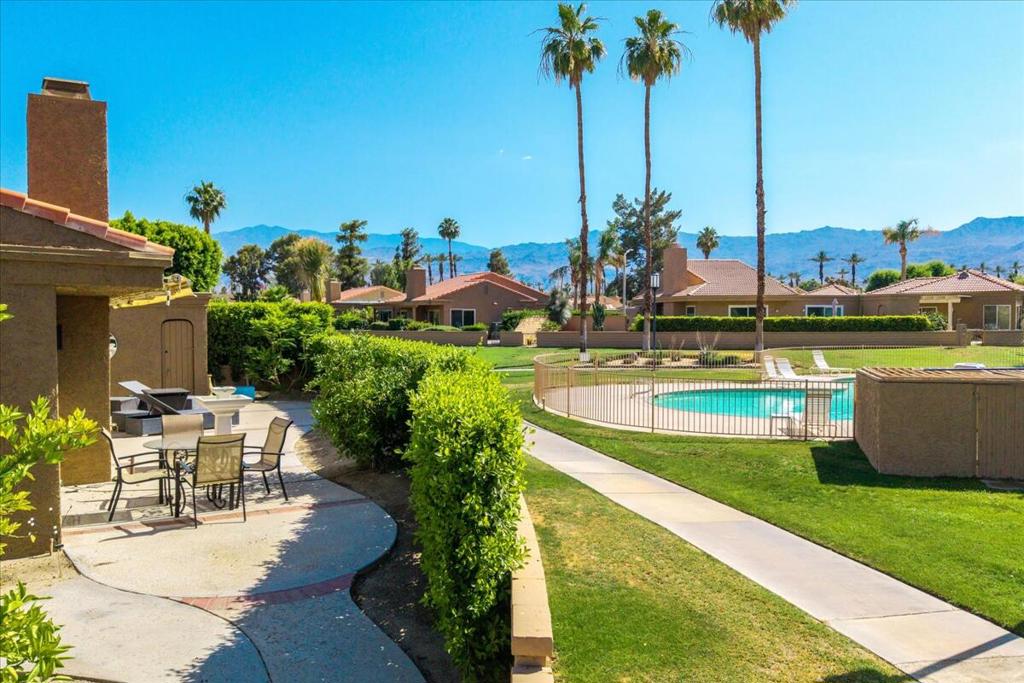 Tucked away on a quiet cul-de-sac in the gated community of Hidden Palms, this fully renovated 3-bedroom 2-bath home offers privacy and unbeatable location-just blocks from El Paseo, the ''Madison Ave'' of Palm Desert.The chef's kitchen includes new Bosch Cafe' Series appliances, black and white slab granite and a custom island with bar stools. Both bathrooms are completely redone. The living room features a brick gas fireplace, ceramic logs and stunning mountain views.Enjoy the secluded, west-facing garden with mature hedges, outdoor shower room and steps away from the community pool. Hidden Palms also offers tennis and pickleball courts, walking paths and lush landscaping with ponds and fountains. Furniture is negotiable No showings before Oct 1, 2025. Owner occupied.
