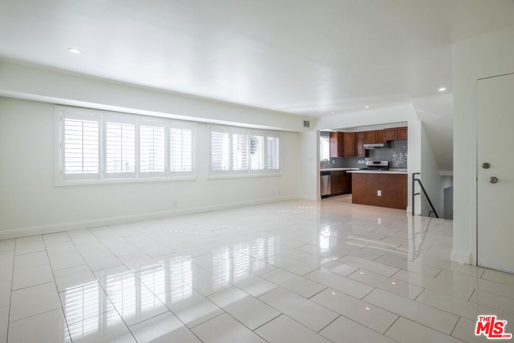 Designer-Remodeled Townhome style Apt in Prime Beverly Hills!Stunning, fully renovated townhome-style apartment in the heart of Beverly Hills. This spacious unit offers approximately 1,400sq ft, 2 BD, 2 BA, 1 parking. Updated kitchen with quartz countertops and stainless steel appliances. Spacious, open living room, master bedroom with en-suite bathroom, double sinks, Bathtub, walk in closet and second bedroom (downstairs) with its own bathroom & standing shower. Central Heating & AC, Tile floor throughout, modern wood shutter window coverings, and LED lighting throughout. New shower head, spout & handle. In- unit LG washer & dryer included. Located in a fantastic Beverly Hills location close to shops, restaurants, and just 10 minutes from Rodeo Drive. Part of the renowned Beverly Hills Unified School District